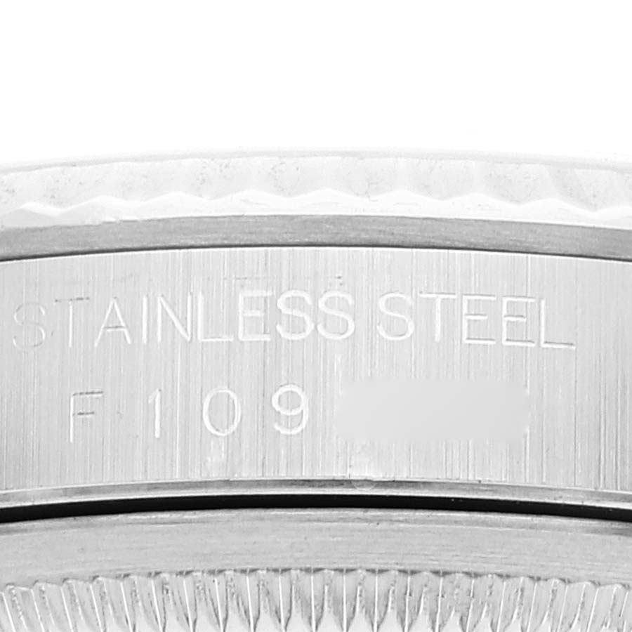 The image shows a close-up of the stainless steel case back of a Rolex Datejust 16234 Men's Stainless Steel Silver Dial 16234 Men's Stainless Steel Silver Dial watch with engravings.