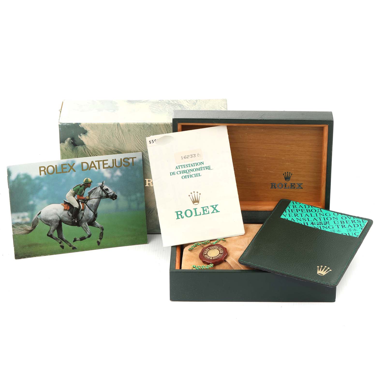 The image shows the packaging and accessories for a Rolex Datejust 16233 Men's Steel and Gold (two tone) Champagne Dial 16233 Men's Steel and Gold (two tone) Champagne Dial, including booklets, tags, and an open watch box.