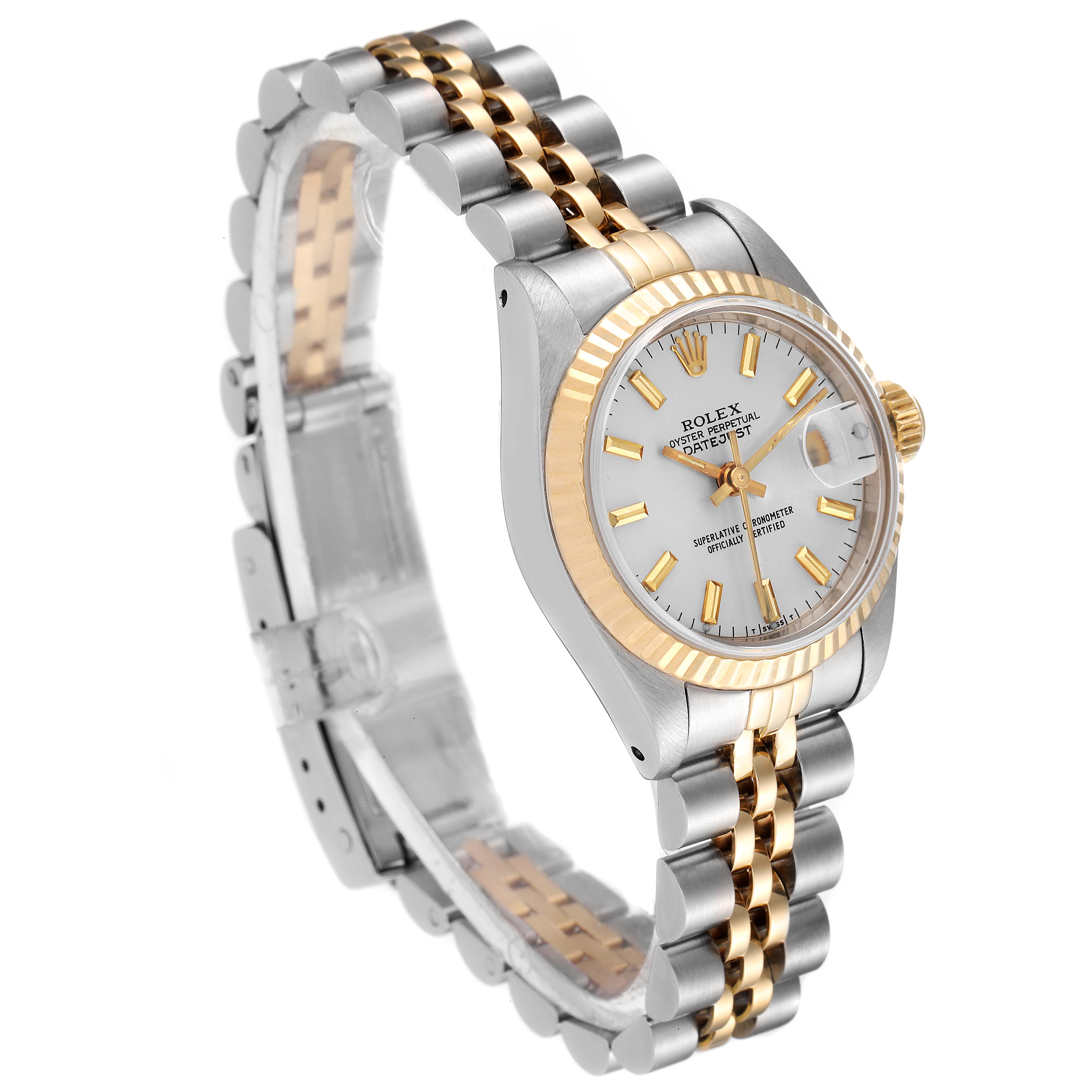 This image shows a Rolex Datejust 69173 Women
s Steel and Gold (two tone) Silver Dial 69173 Women
s Steel and Gold (two tone) Silver Dial watch at an angle highlighting its Jubilee bracelet and golden fluted bezel.