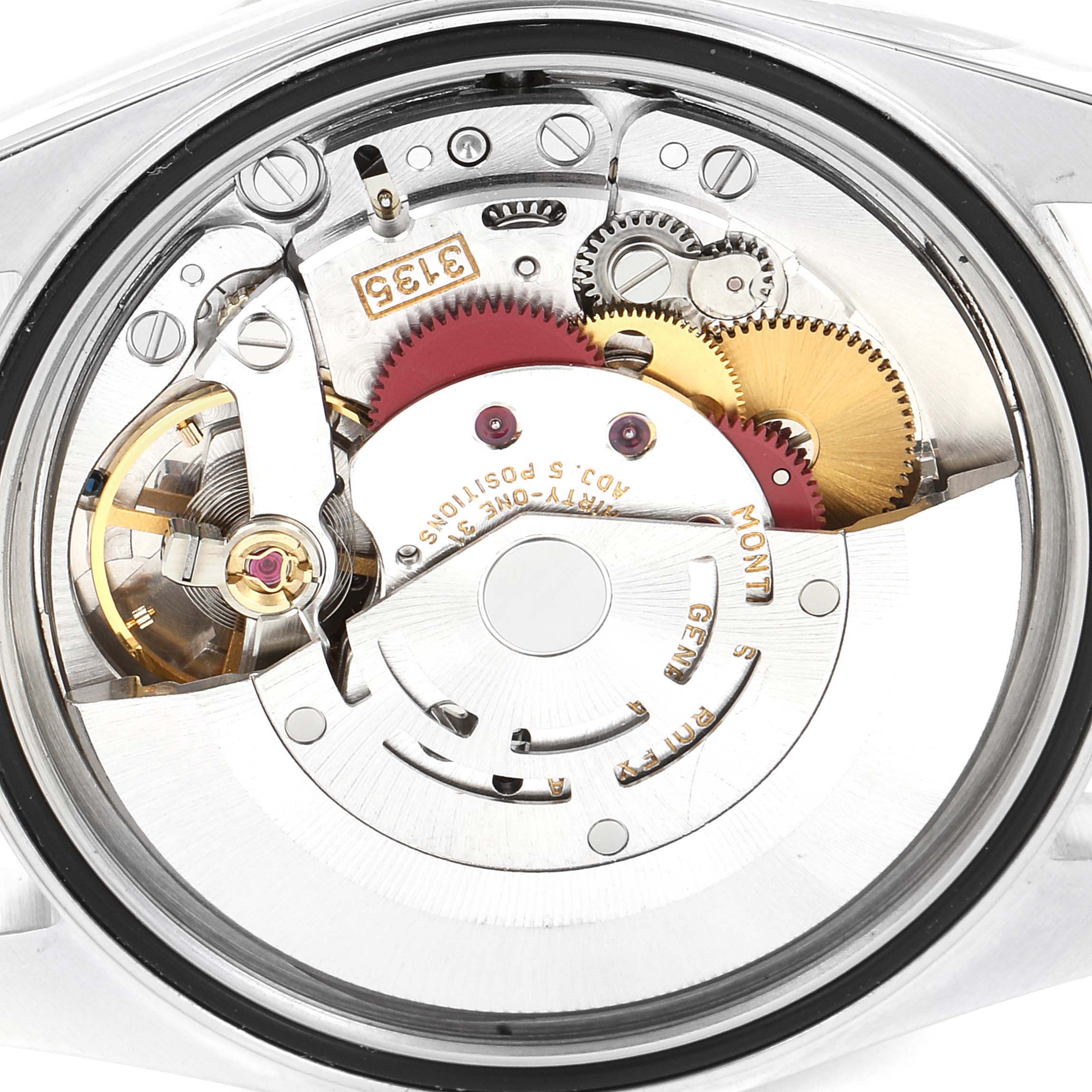 This image shows the inner workings and movement of the Rolex Datejust 16233 Men's Steel and Gold (two tone) White Dial 16233 Men's Steel and Gold (two tone) White Dial watch from a rear angle.
