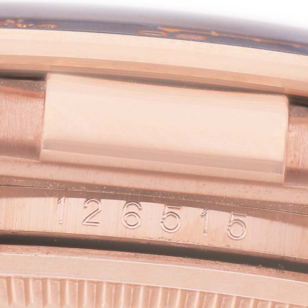 The image shows the side view of the Rolex Daytona 126515 Men's Rose Gold Black Dial, focusing on the model number "126515" engraved on the case.