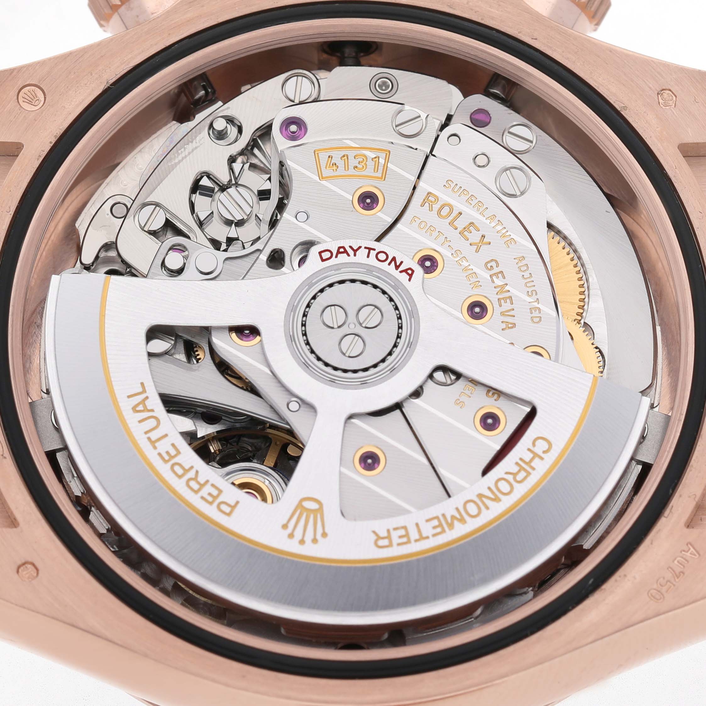 The image shows the movement parts of a Rolex Daytona 126515 Men's Rose Gold Black Dial watch from a rear angle, highlighting the rotor and internal components.