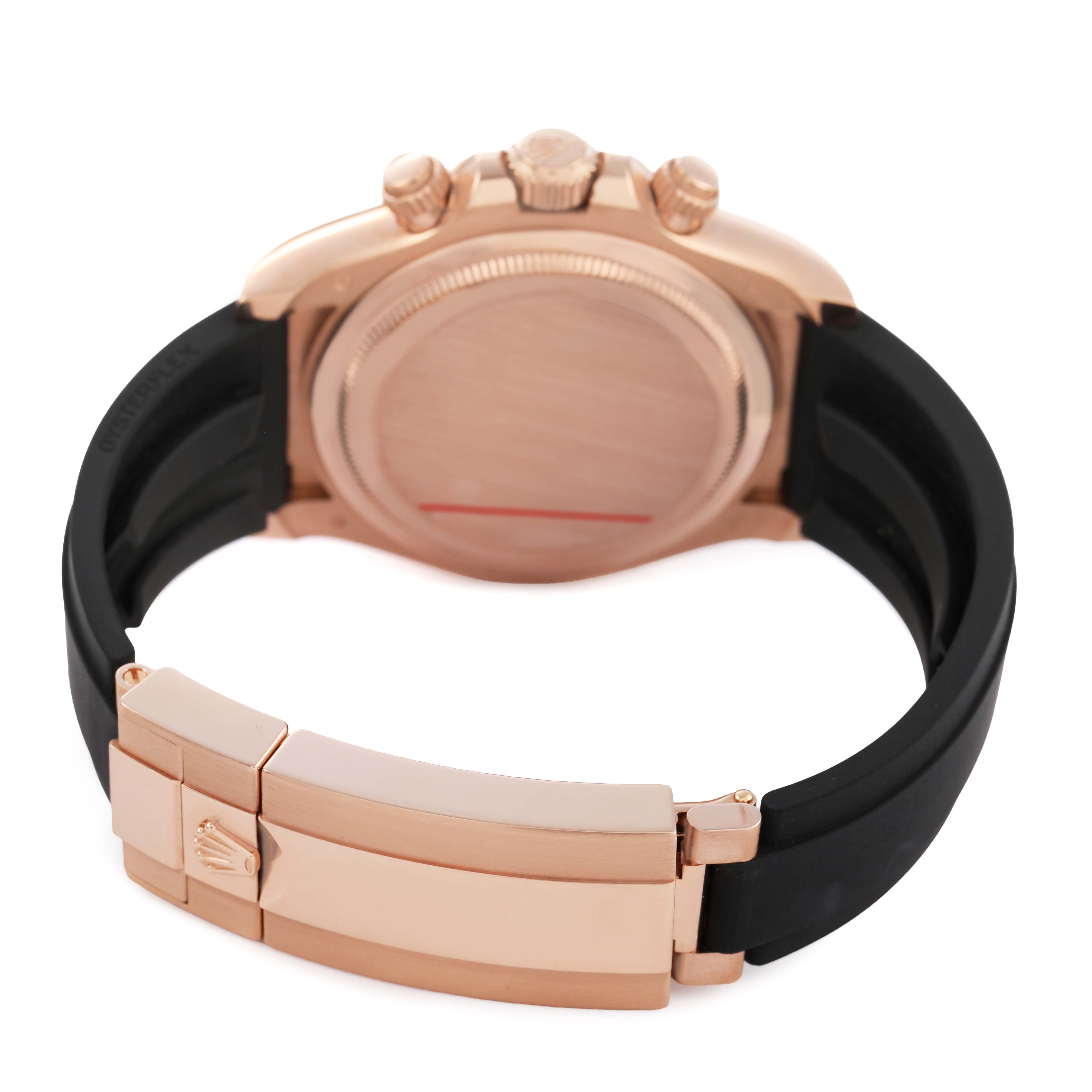 The image shows the back and side profile of a Rolex Daytona 126515 Men's Rose Gold Black Dial, highlighting its clasp, case back, and crown.