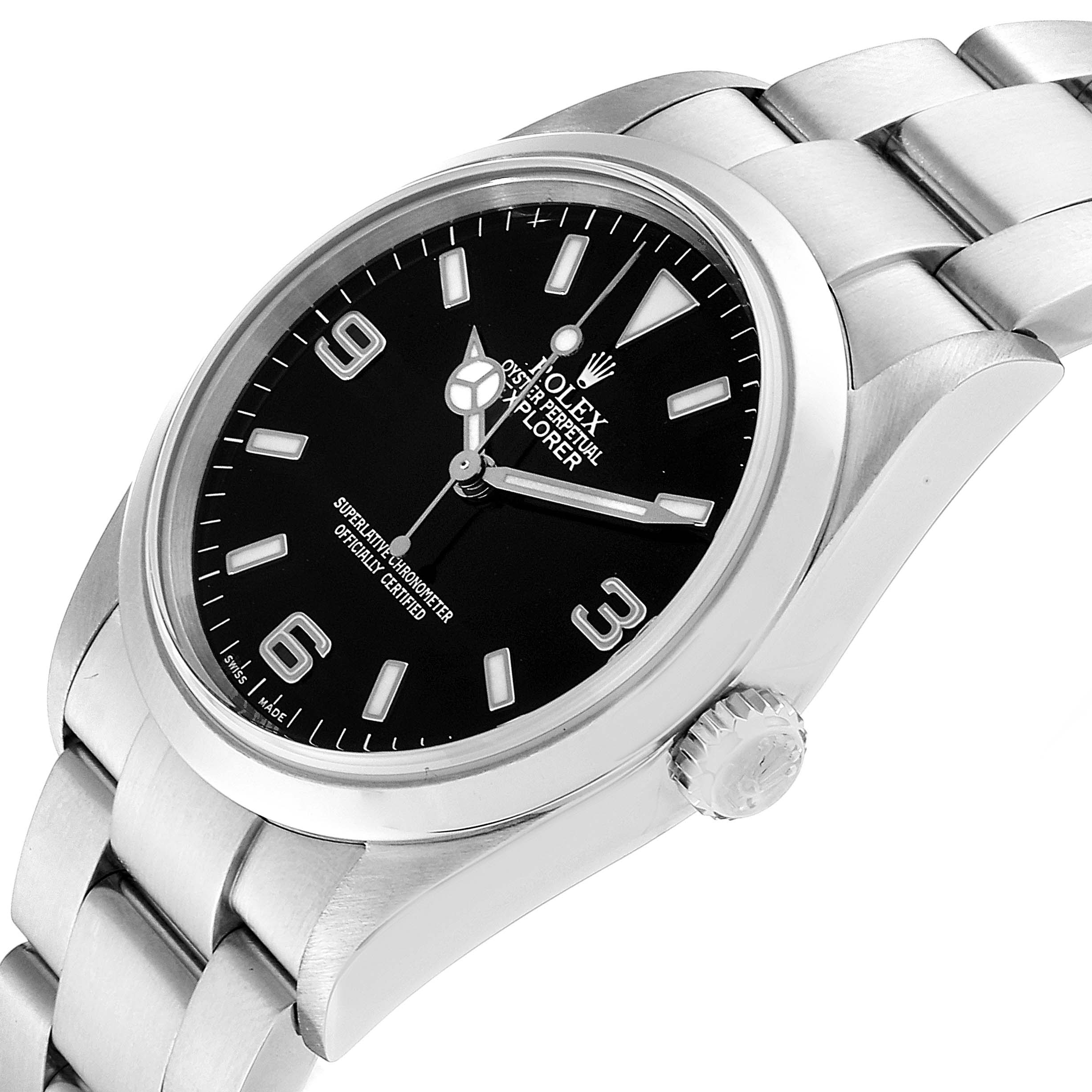 The image shows a close-up angle of the Rolex Explorer 114270 Men
s Stainless Steel Black Dial 114270 Men
s Stainless Steel Black Dial model, highlighting the dial, crown, and portion of the bracelet.