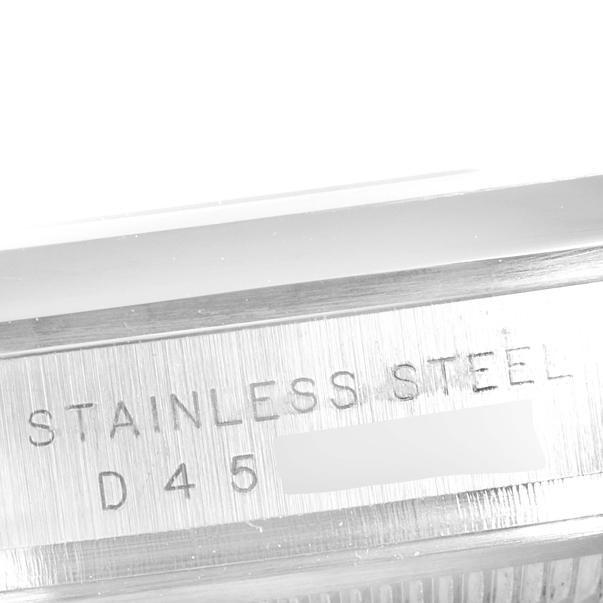 The image shows a close-up of the case side of a Rolex Explorer 114270 Men
s Stainless Steel Black Dial 114270 Men
s Stainless Steel Black Dial model, indicating it is made of stainless steel.