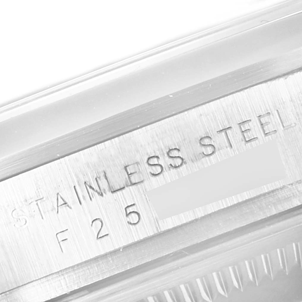 This image shows a close-up of the stainless steel case back of a Rolex Explorer 114270 Men's Stainless Steel Black Dial 114270 Men's Stainless Steel Black Dial watch.