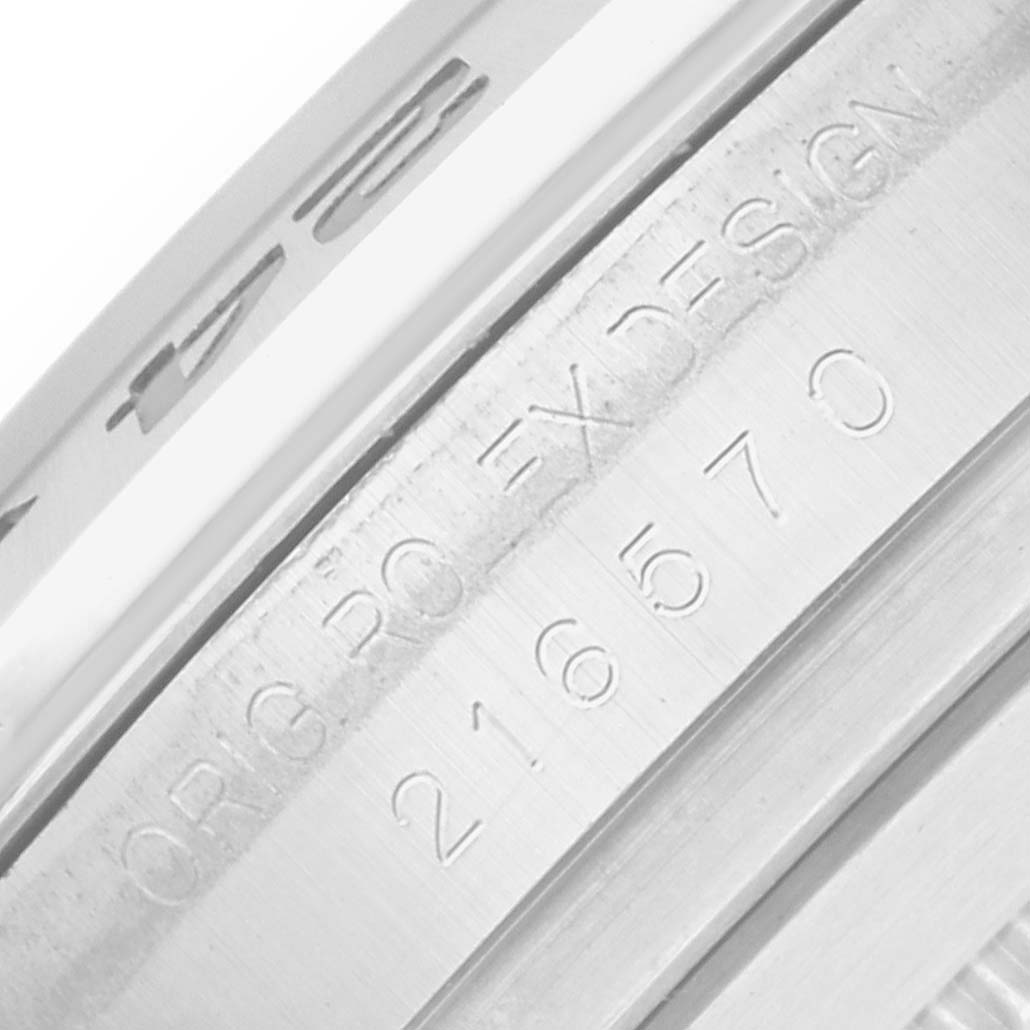 The image shows a close-up of the inner bezel with engravings on a Rolex Explorer 216570 Men
s Stainless Steel Black Dial model.