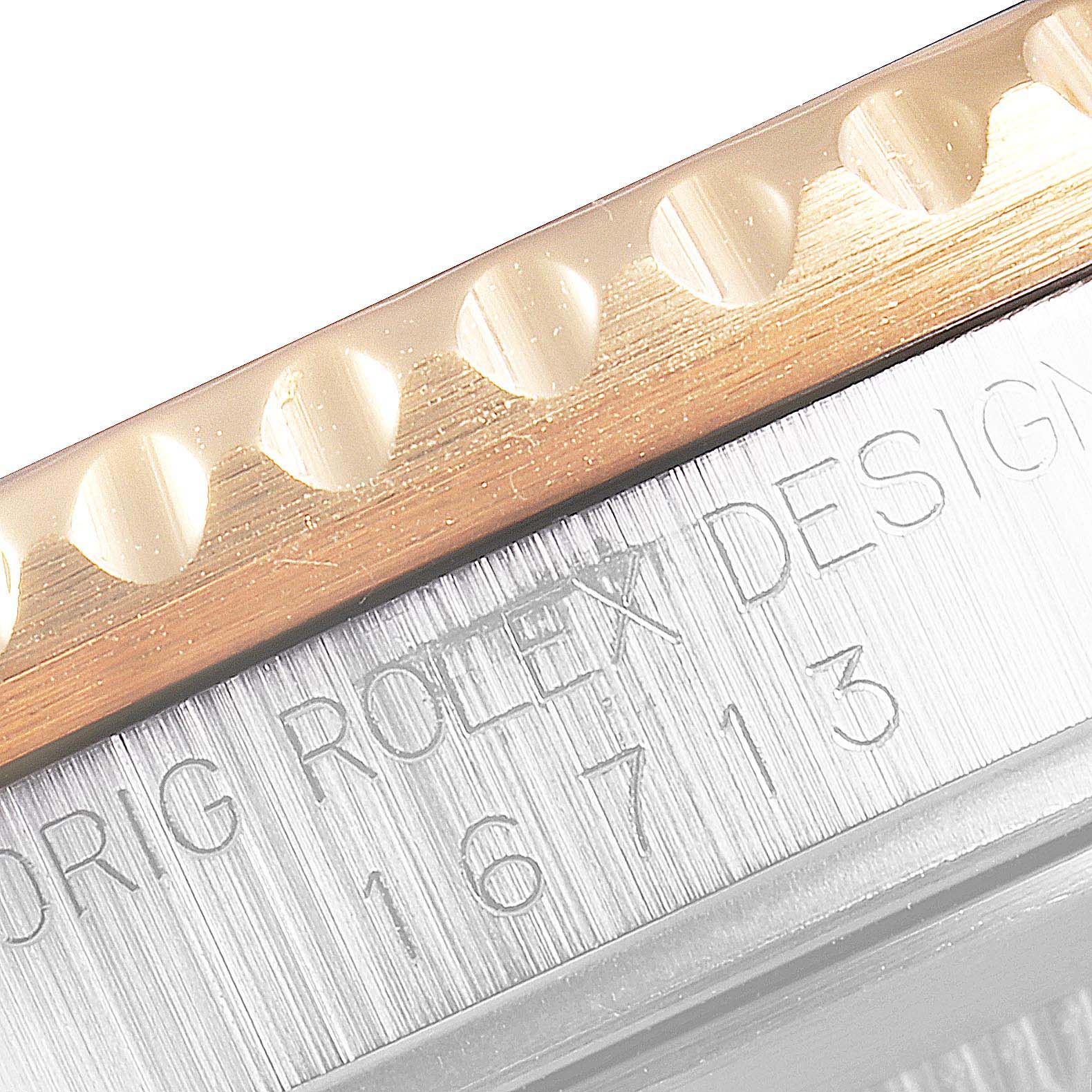 The image shows a close-up of the side edge and bezel of a Rolex GMT-Master 16713 Men's Steel and Gold (two tone) Black Dial 16713 Men's Steel and Gold (two tone) Black Dial watch, highlighting its model number "16713."