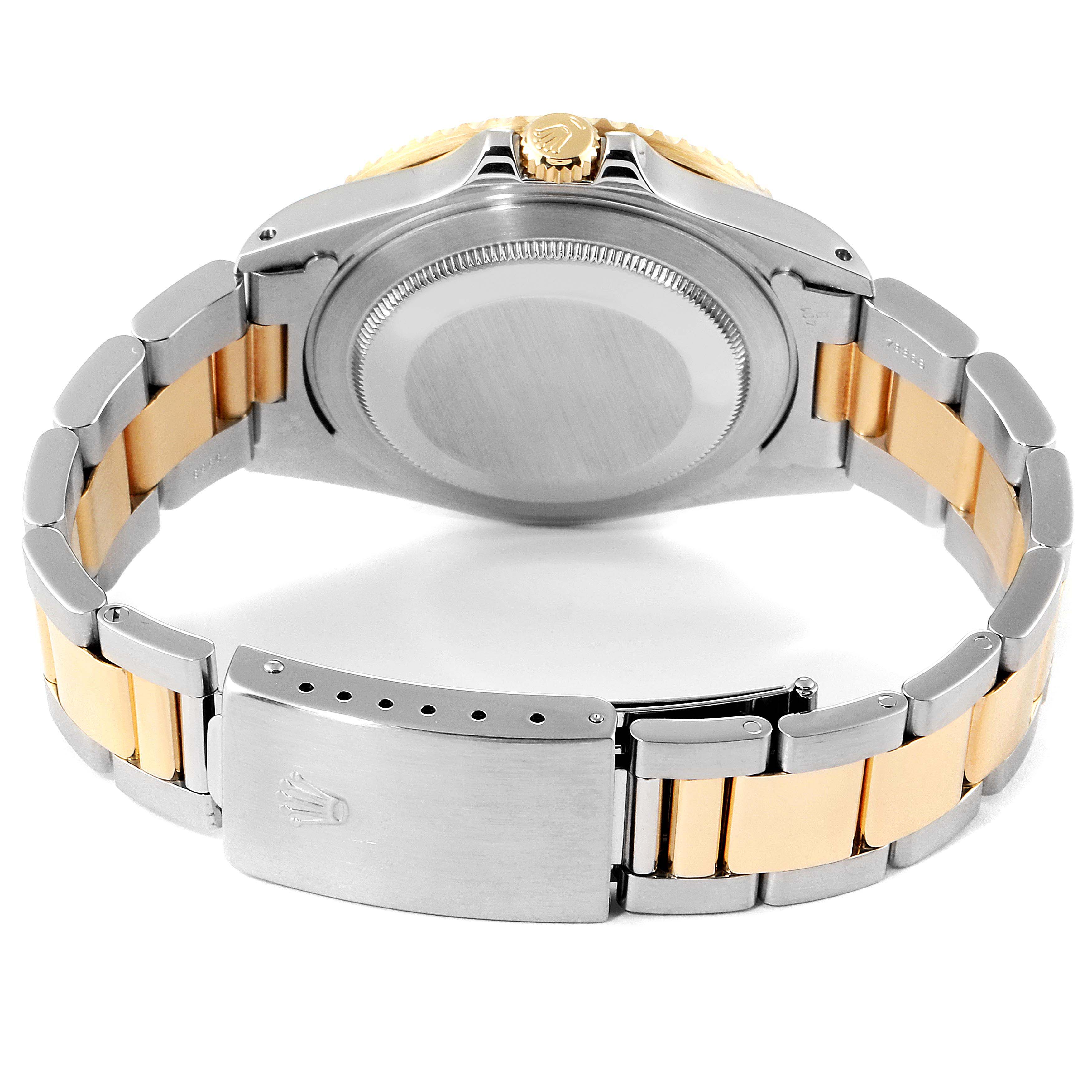 This image shows the back case and bracelet of a Rolex GMT-Master 16713 Men's Steel and Gold (two tone) Black Dial 16713 Men's Steel and Gold (two tone) Black Dial watch, highlighting the clasp and crown.