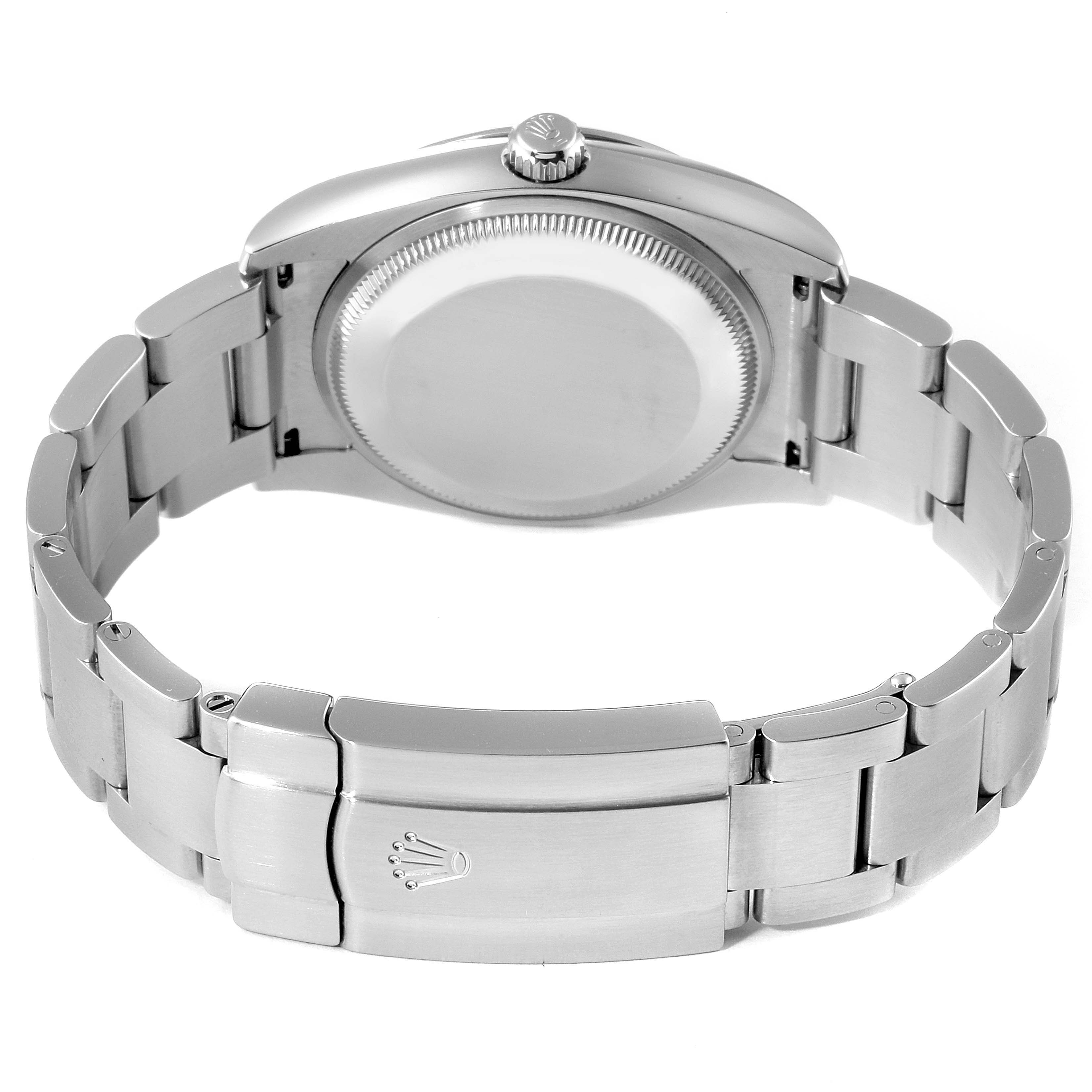 The image shows the back view of a Rolex Oyster Perpetual 114200 Men's Stainless Steel Green Dial 114200 Men's Stainless Steel Green Dial watch, highlighting the caseback, crown, and bracelet clasp.