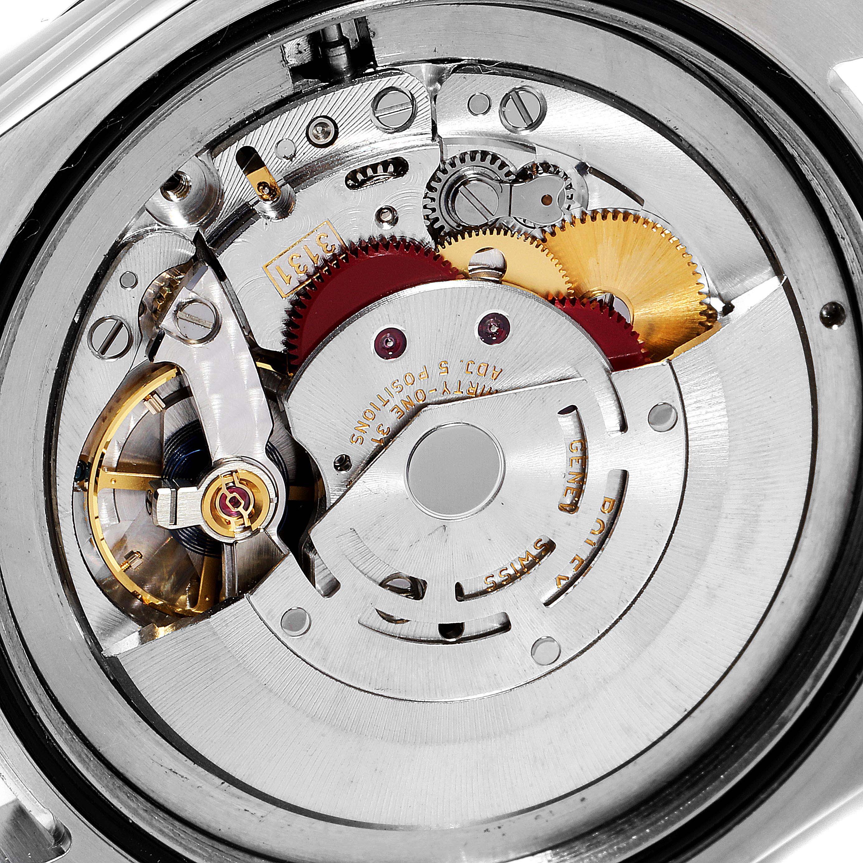 This image shows a close-up of the internal mechanism of a Rolex Air-King 116900 Men's Stainless Steel Black Dial 116900 Men's Stainless Steel Black Dial watch, highlighting its gears and movement components.