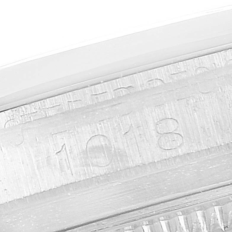 This close-up image shows the engraved serial number on the case of a Vintage Collection model by Rolex.