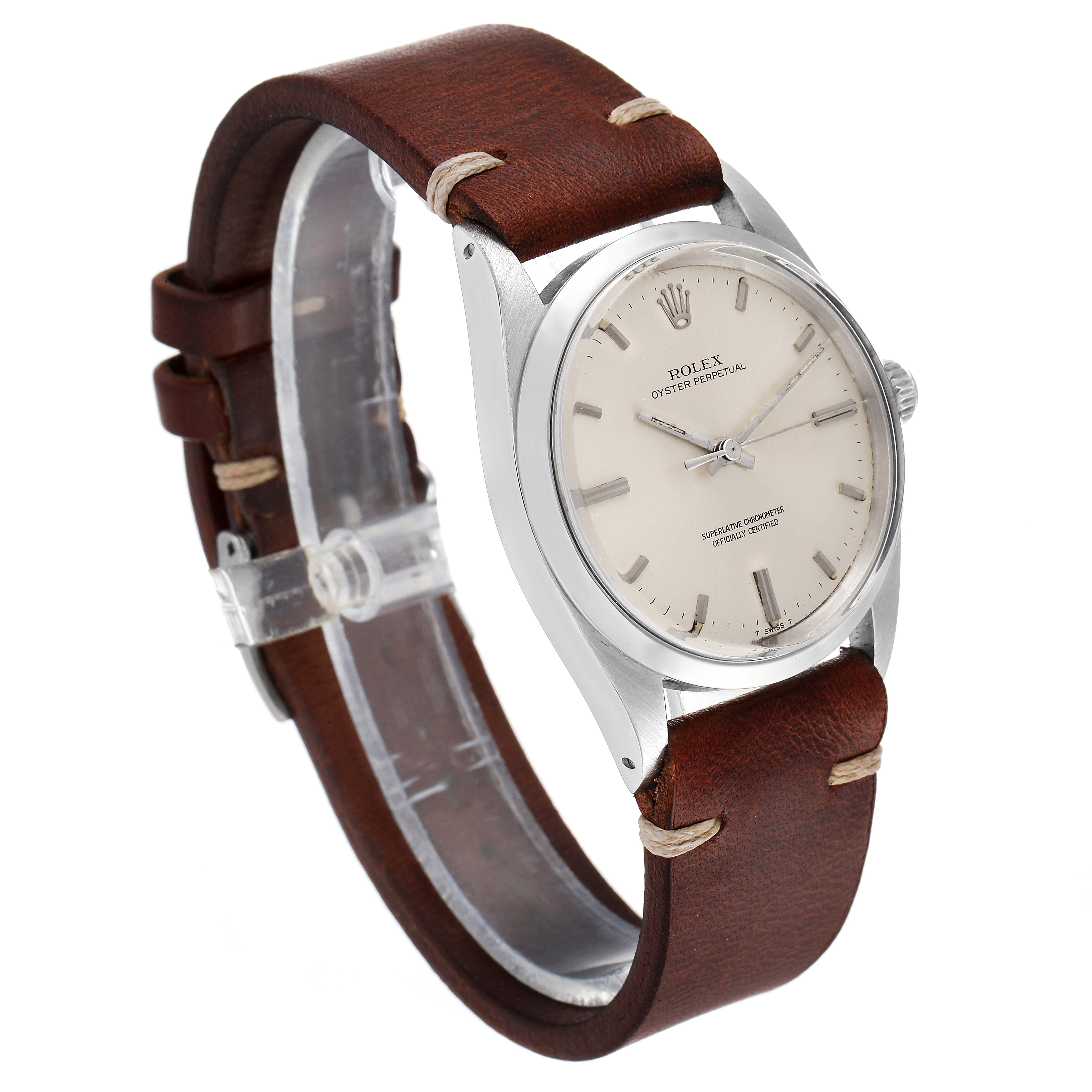 The image shows a side angle of the Rolex Vintage Collection 1018 Men's Stainless Steel Silver Dial 1018 Men's Stainless Steel Silver Dial watch, highlighting its face, case, crown, and leather strap.