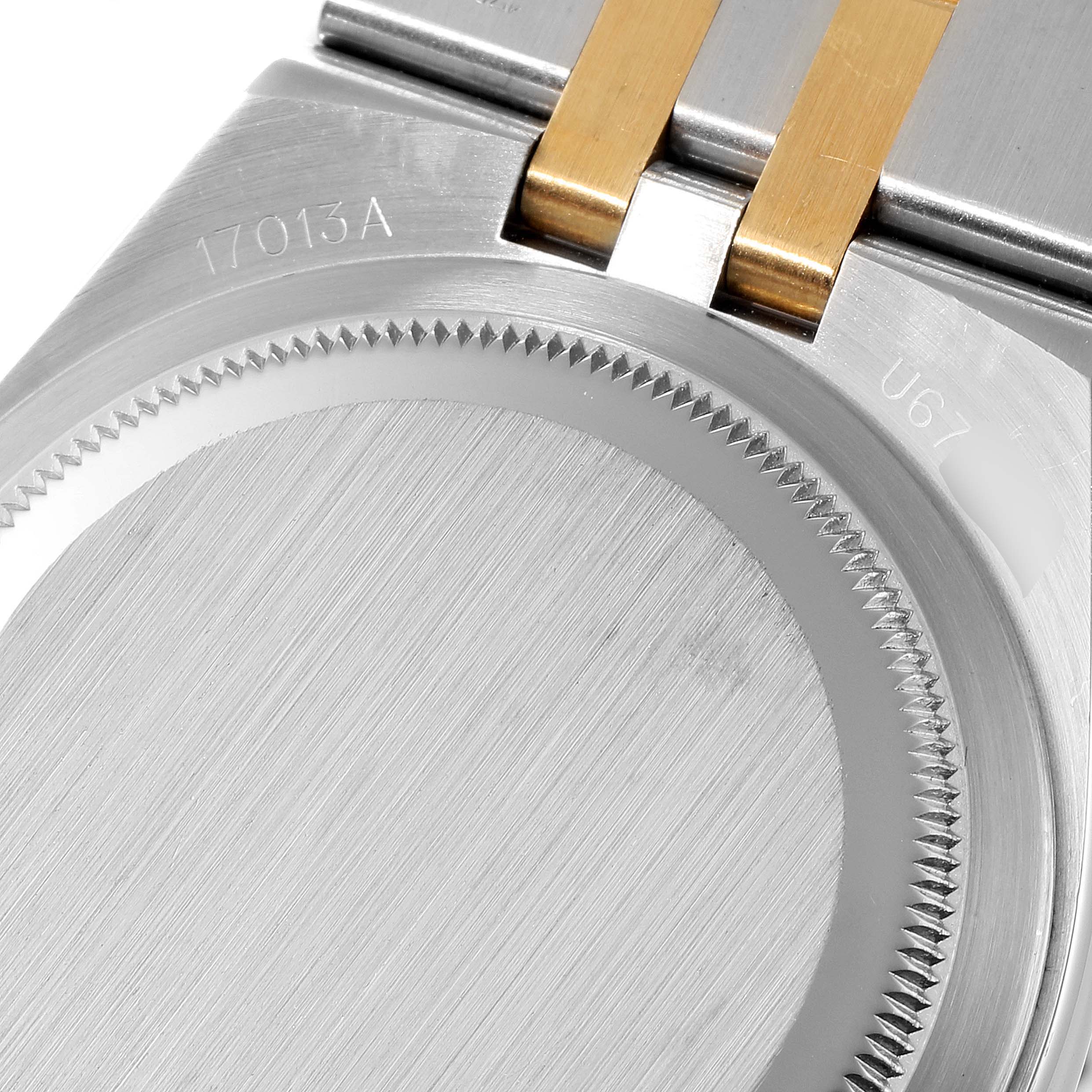 The image shows the back case and part of the bracelet of the Rolex Oysterquartz 17013 Men's Steel and Gold (two tone) Champagne Dial 17013 Men's Steel and Gold (two tone) Champagne Dial model, with visible reference numbers.