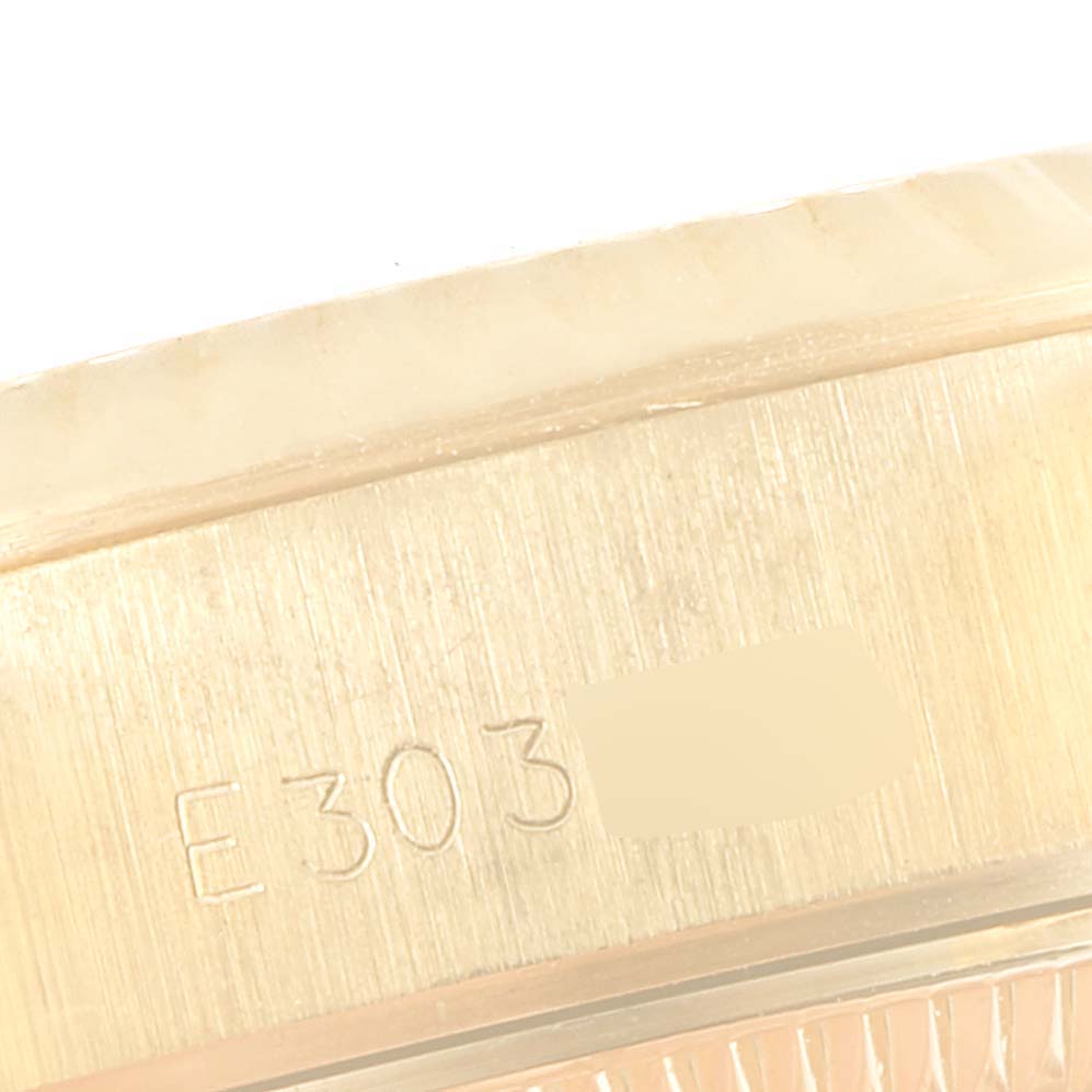 The image shows a close-up of the inner side of the casing of a Rolex President 69178 Women's Yellow Gold Champagne Dial 69178 Women's Yellow Gold Champagne Dial model watch, featuring etched numbering.