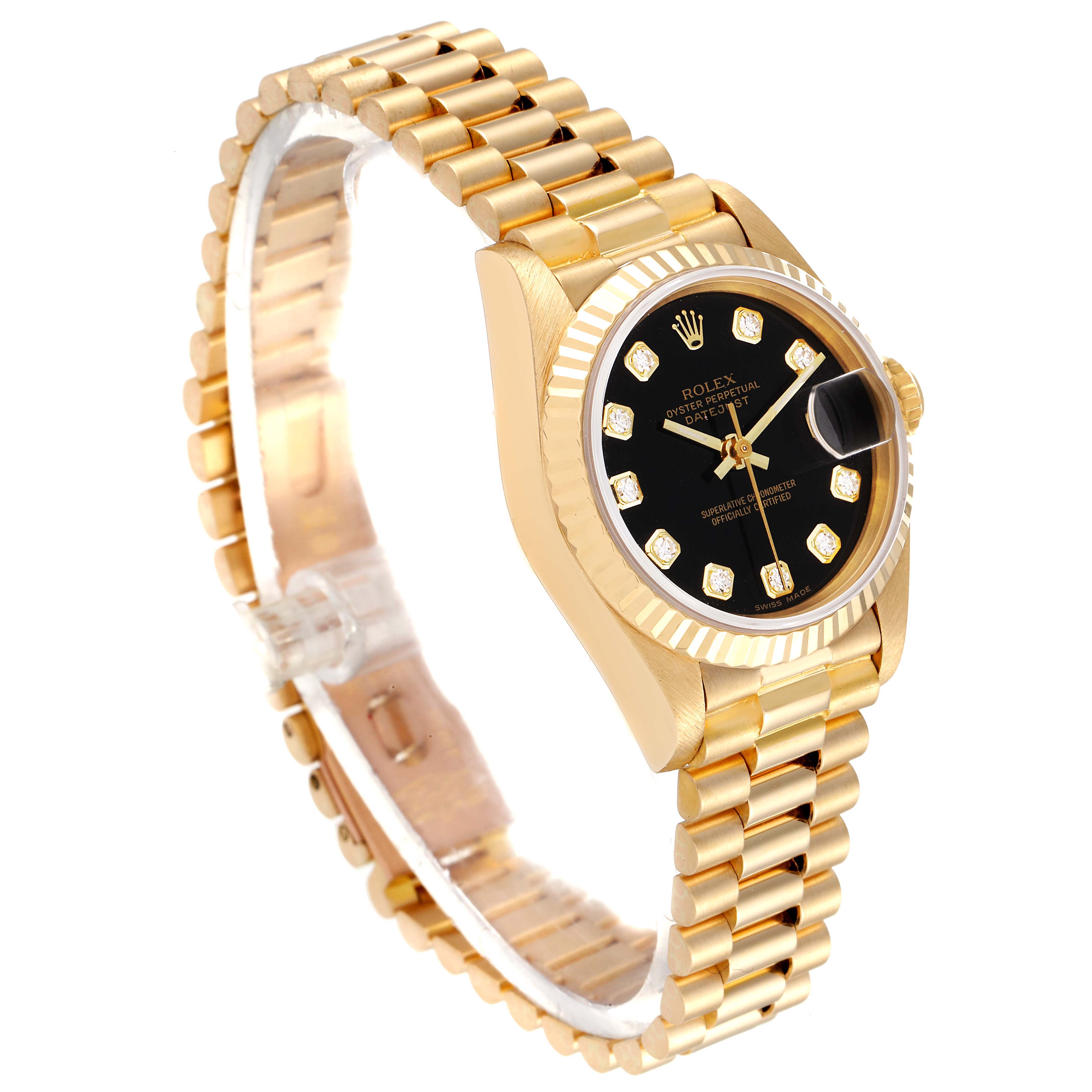 The Rolex President 69178 Women's Yellow Gold Black Dial 69178 Women's Yellow Gold Black Dial model watch is shown at an angle displaying the gold bracelet, black dial, diamond hour markers, and date window.
