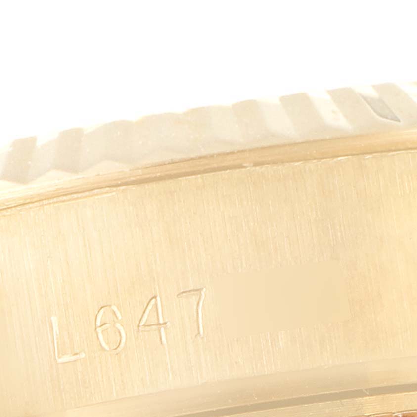 This image shows a close-up angle of the side casing with serial engraving of a Rolex President 69178 Women's Yellow Gold Black Dial 69178 Women's Yellow Gold Black Dial model watch.