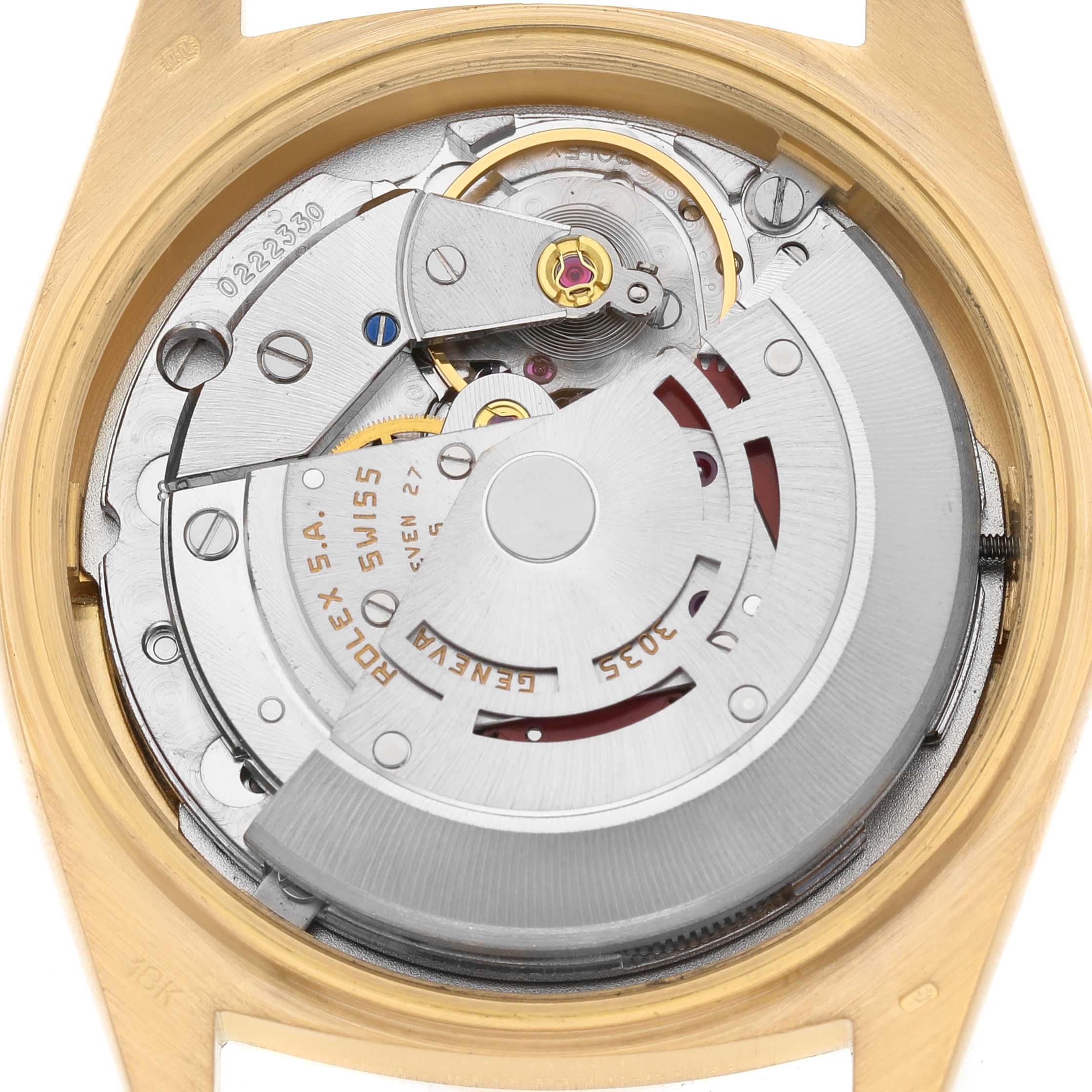 The image shows the internal movement of a Rolex President 18038 Men's Yellow Gold Champagne Dial model watch viewed from the back, featuring its intricate mechanical components.