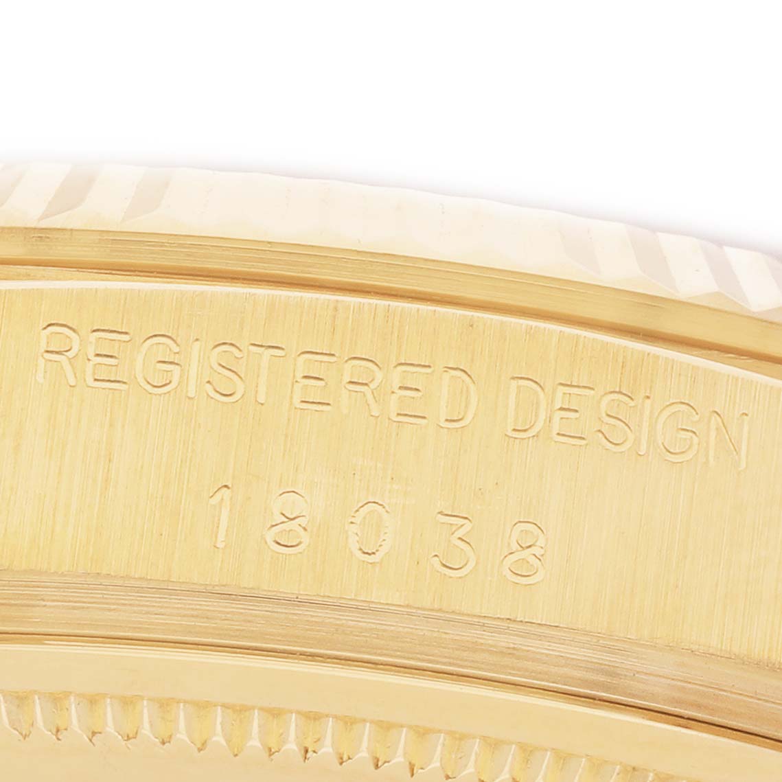 The image shows a close-up of the case edge with the model number 18038 engraved, part of the Rolex President 18038 Men's Yellow Gold Champagne Dial watch.