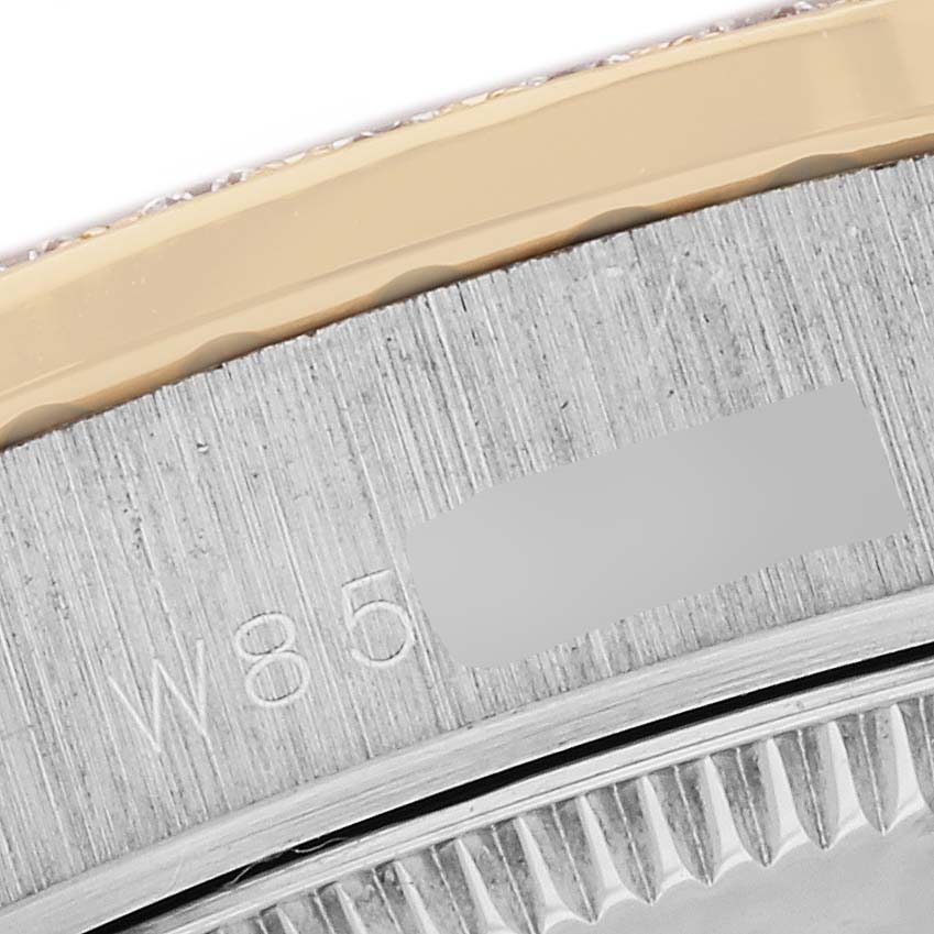 This close-up image shows the bezel and part of the case of a Rolex President 68289 Women's White Gold Silver Dial 68289 Women's White Gold Silver Dial watch model.