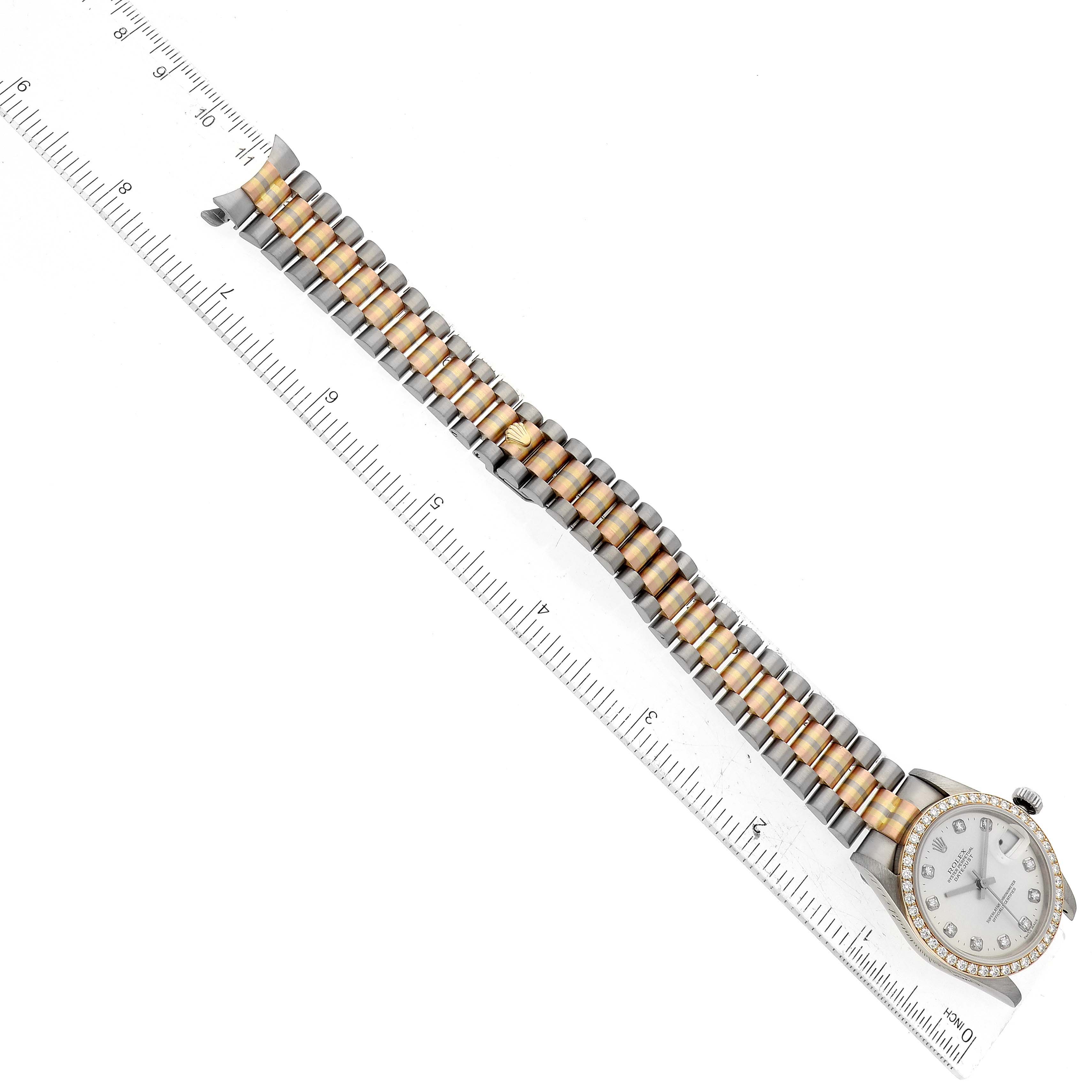 The image depicts a Rolex President 68289 Women's White Gold Silver Dial 68289 Women's White Gold Silver Dial model watch shown from above with a close-up of its band measured against a ruler.