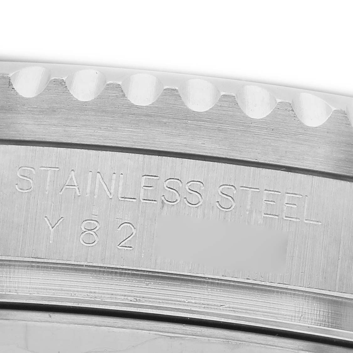 The image shows a close-up of the Rolex Sea-Dweller 16600 Men's Stainless Steel Black Dial's case edge, highlighting the stainless steel material and part numbers.