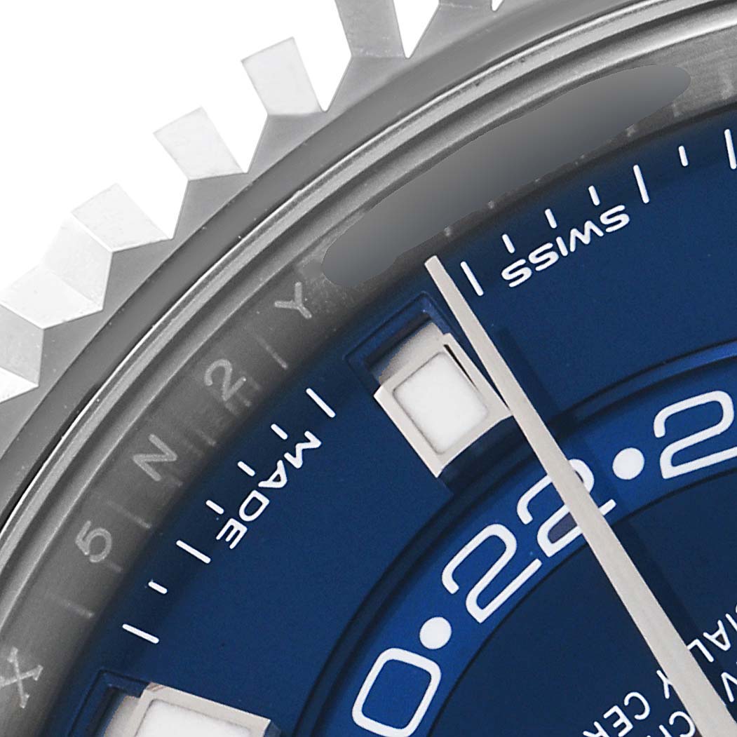 This image shows a close-up of the dial and bezel of a Rolex Sky-Dweller 326934 Men's Stainless Steel Blue Dial 326934 Men's Stainless Steel Blue Dial watch, highlighting the "MADE," "SWISS," and part of the date window.