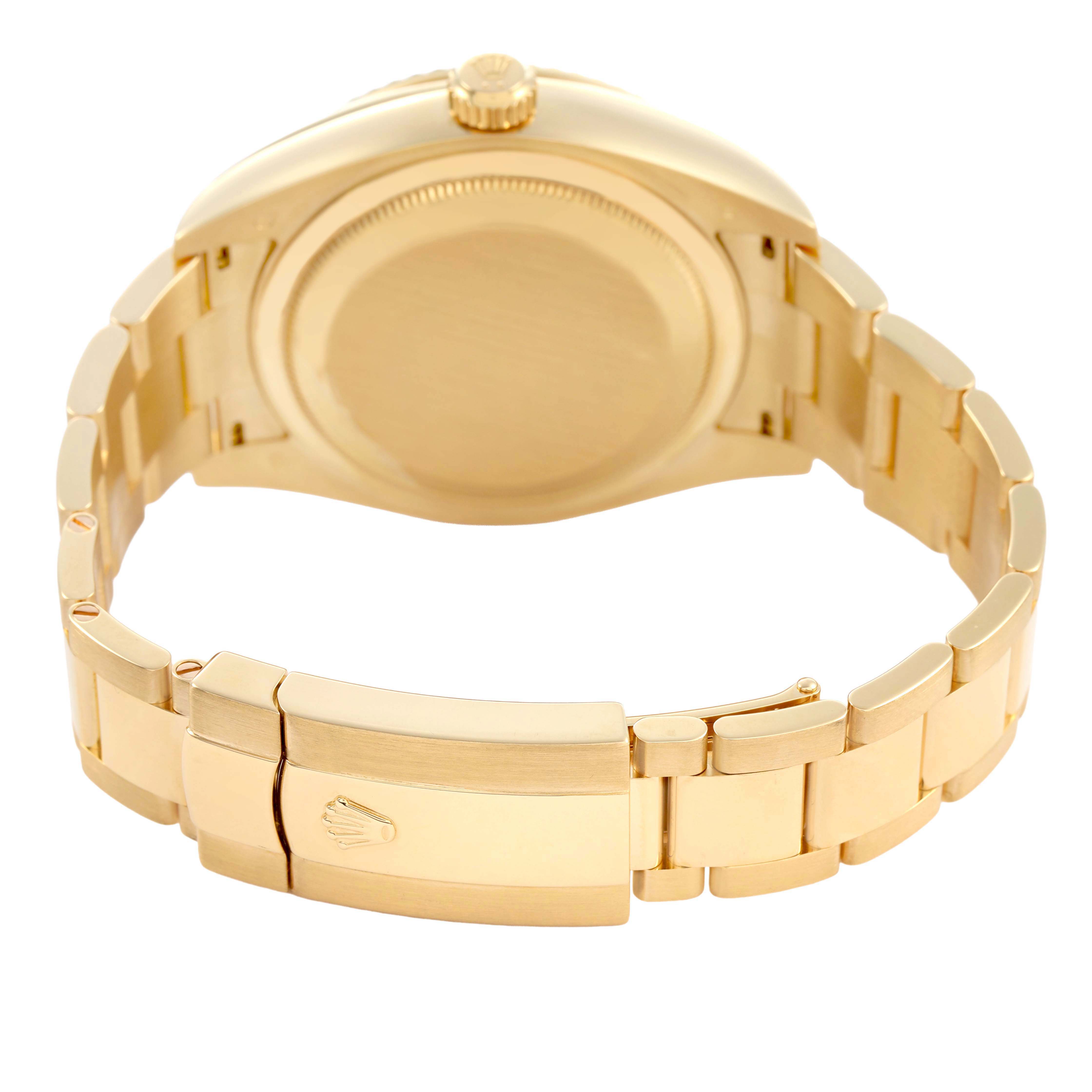 The image shows the back of the Rolex Sky-Dweller 326938 Men's Yellow Gold Silver Dial watch, focusing on the clasp and bracelet in a gold finish.