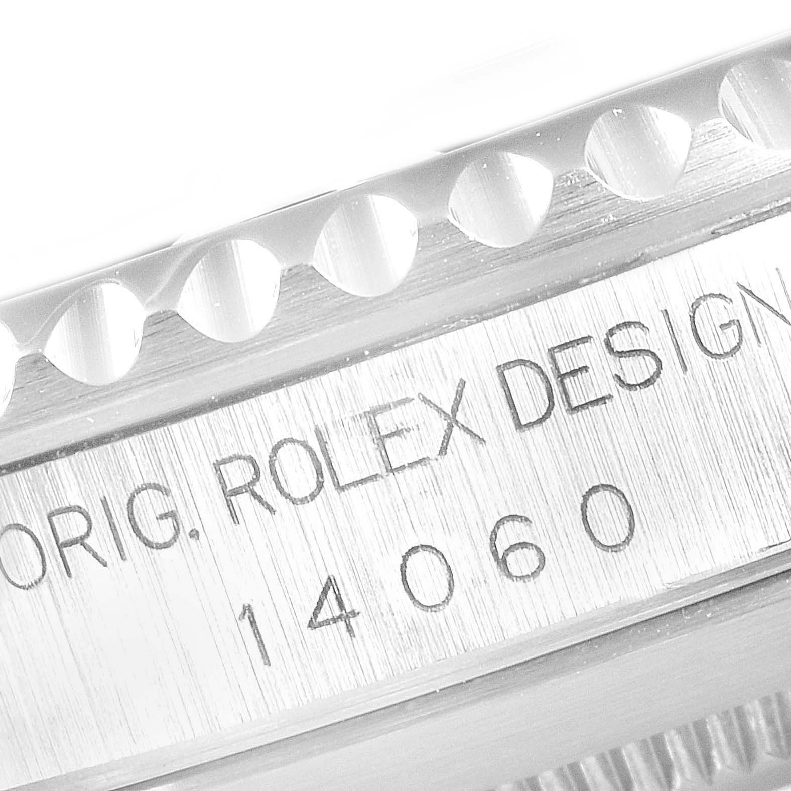This close-up image shows the engraved model number and "Orig. Rolex Design" inscription on the case of a Rolex Submariner 14060 Men
s Stainless Steel Black Dial 14060 Men
s Stainless Steel Black Dial watch.