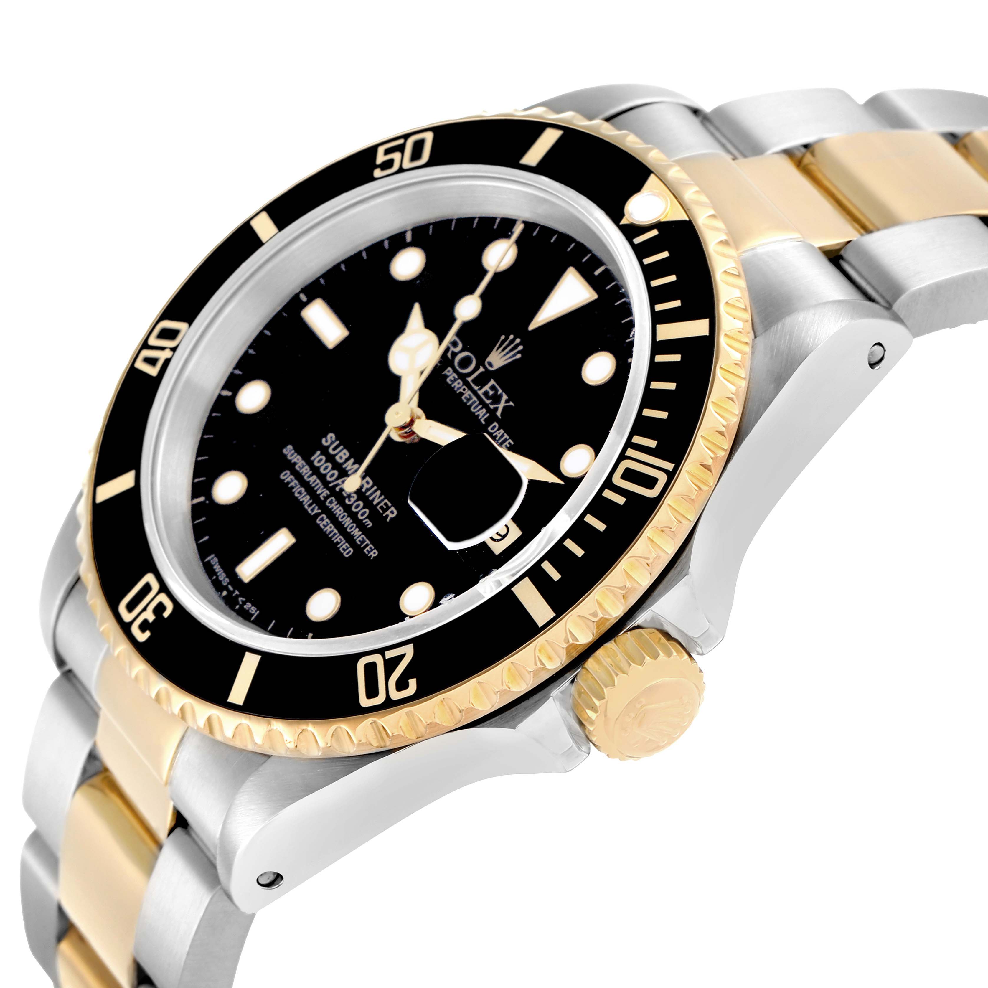 The Rolex Submariner 16613 Men
s Steel and Gold (two tone) Black Dial is shown at a 3/4 angle, displaying the black dial, gold bezel, crown, and two-tone bracelet.