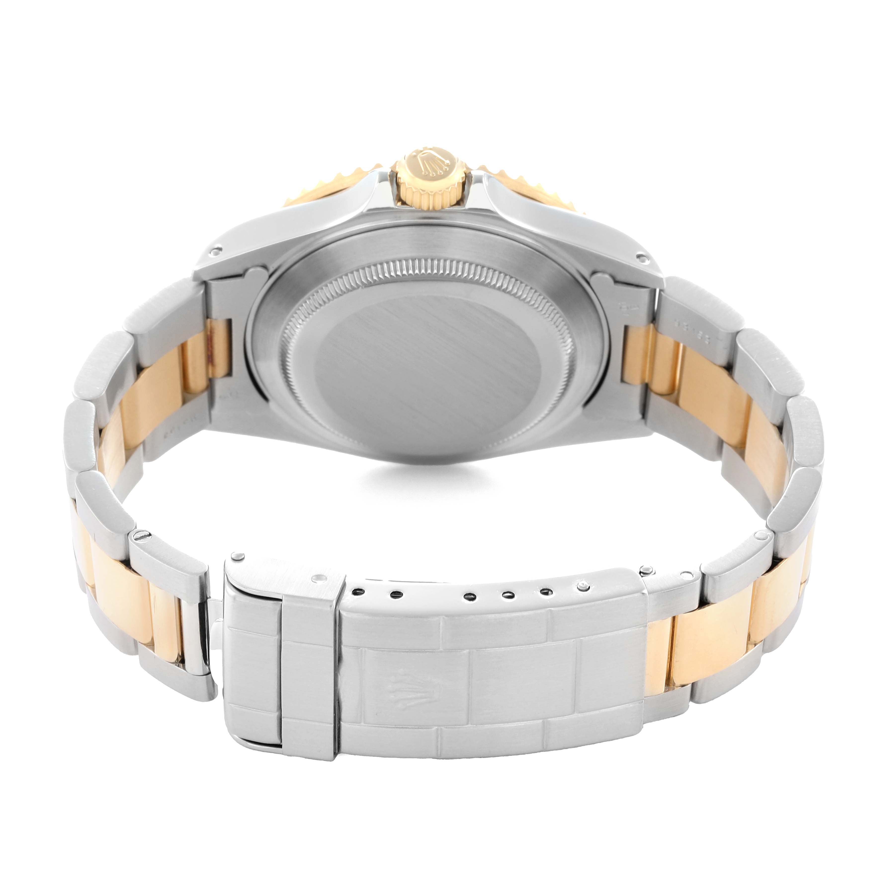 This image shows the back view of a Rolex Submariner 16613 Men
s Steel and Gold (two tone) Black Dial, highlighting the case back, crown, and bracelet.