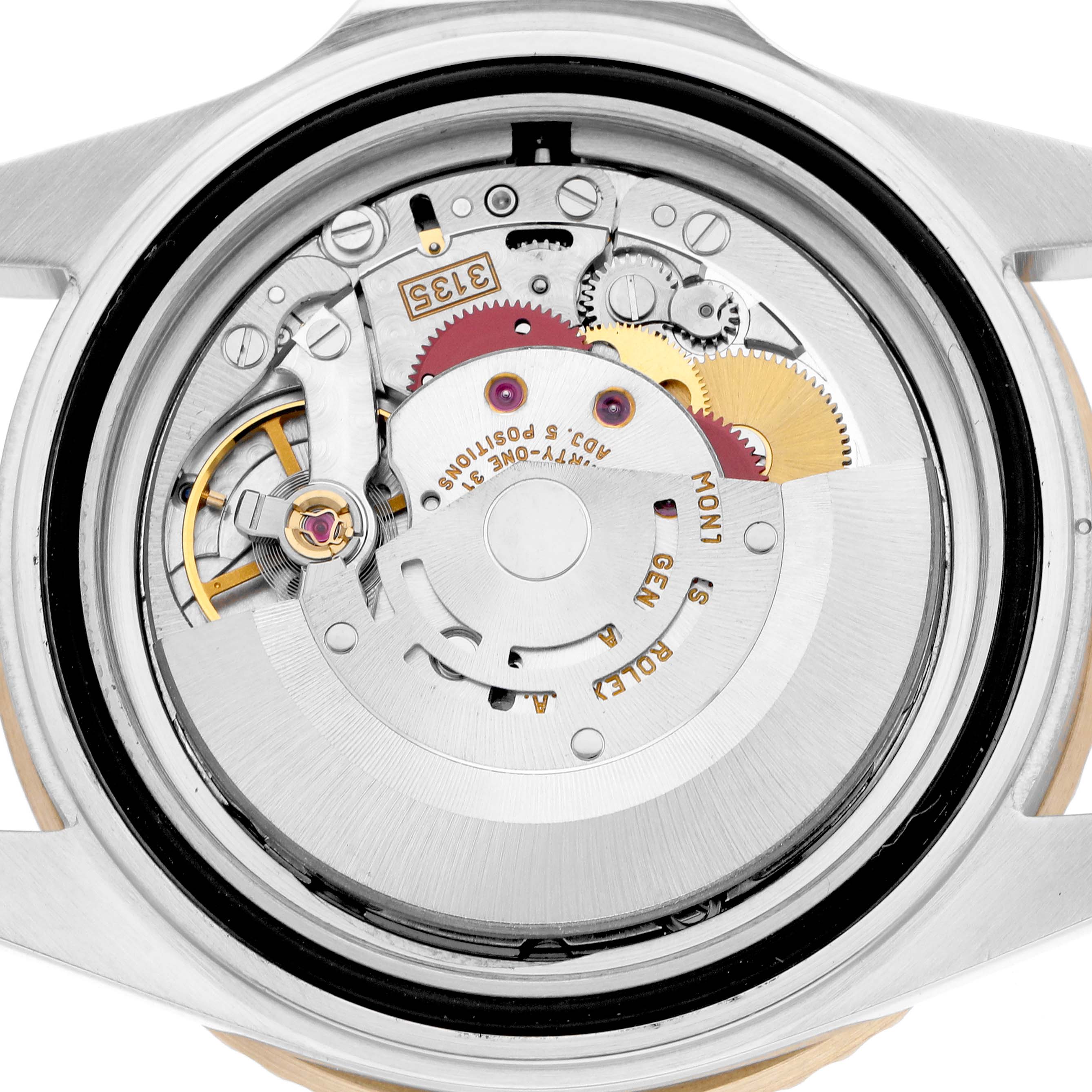 The image shows the movement of a Rolex Submariner 16613 Men
s Steel and Gold (two tone) Black Dial watch with an open case back view, highlighting its internal mechanisms.