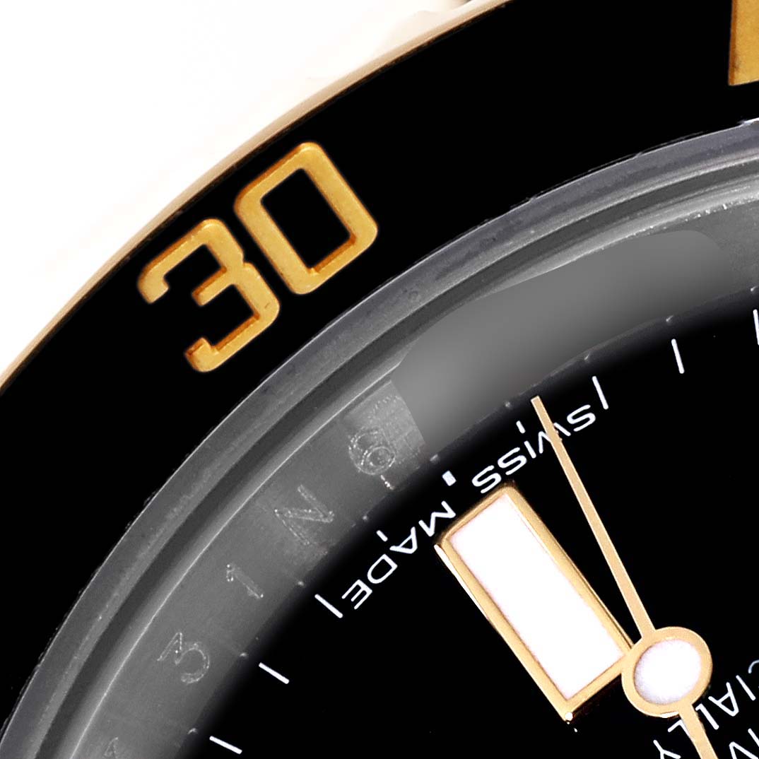 The image shows a close-up of the dial and bezel of a Rolex Submariner 116613 Men's Steel and Gold (two tone) Black Dial 116613 Men's Steel and Gold (two tone) Black Dial watch, highlighting the "30" minute marker.