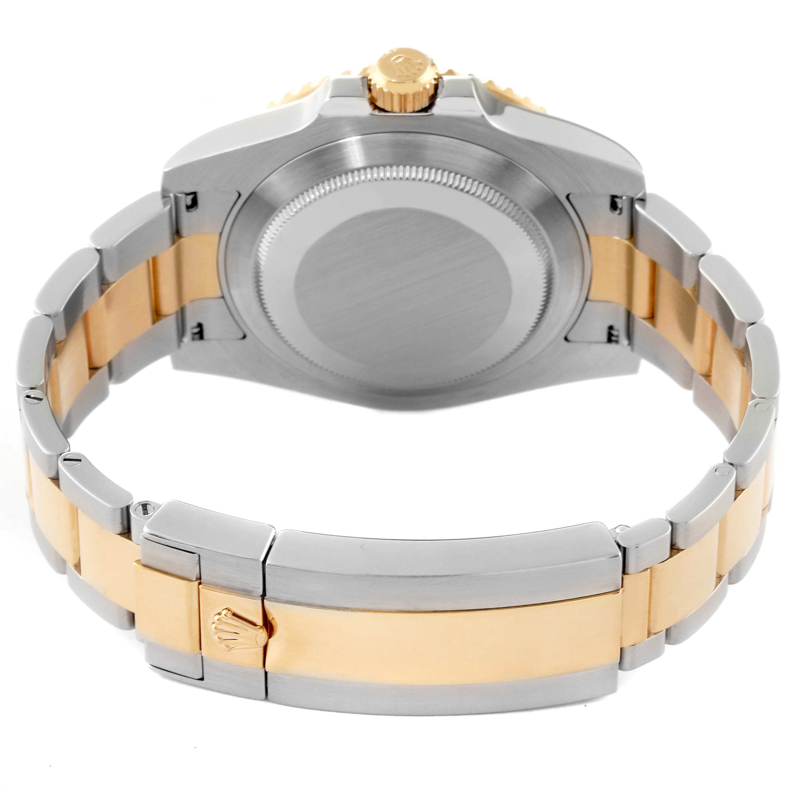 The image shows the back and bracelet of the Rolex Submariner 116613 Men's Steel and Gold (two tone) Black Dial 116613 Men's Steel and Gold (two tone) Black Dial, featuring a two-tone band with Oyster clasp.