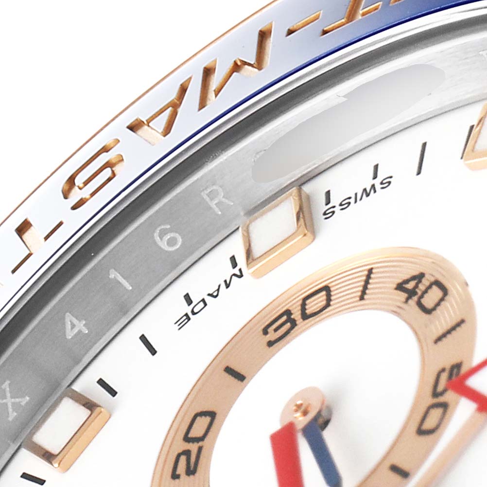 Close-up of the dial and bezel of the Rolex Yacht-Master 116681 Men's Steel and Gold (two tone) White Dial 116681 Men's Steel and Gold (two tone) White Dial watch, showing the gold markers and part of the "Yacht-Master" inscription.