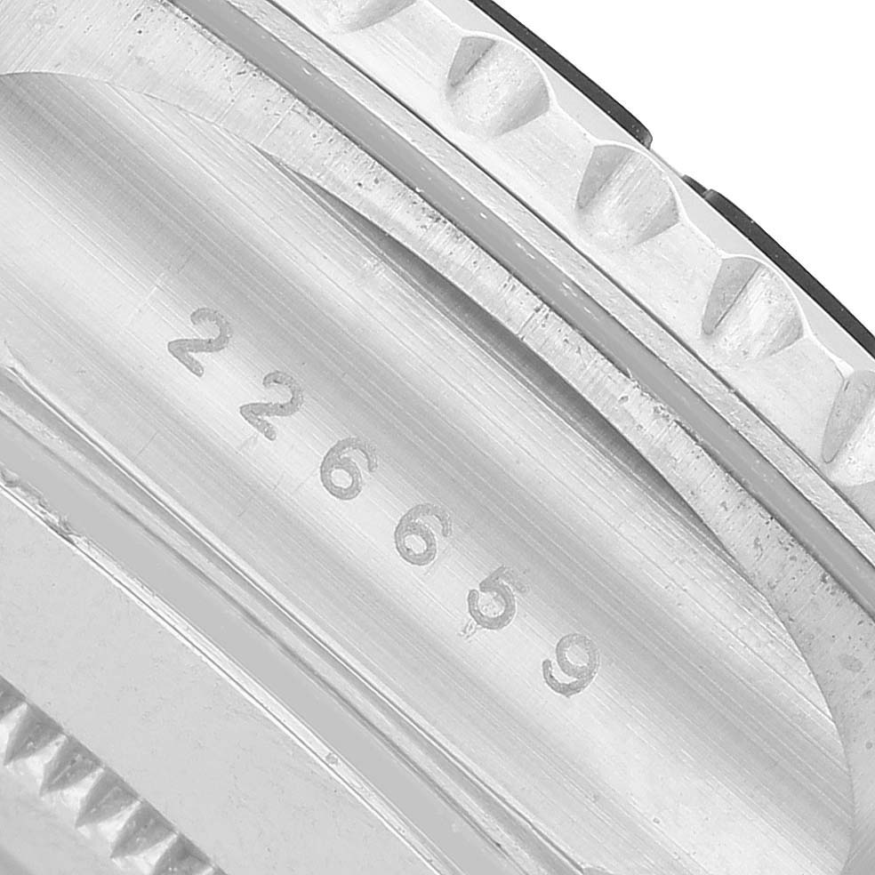 The image displays the serial number engraving and part of the bezel edge of a Rolex Yacht-Master 226659 Men's White Gold Black Dial watch from a close-up angle.