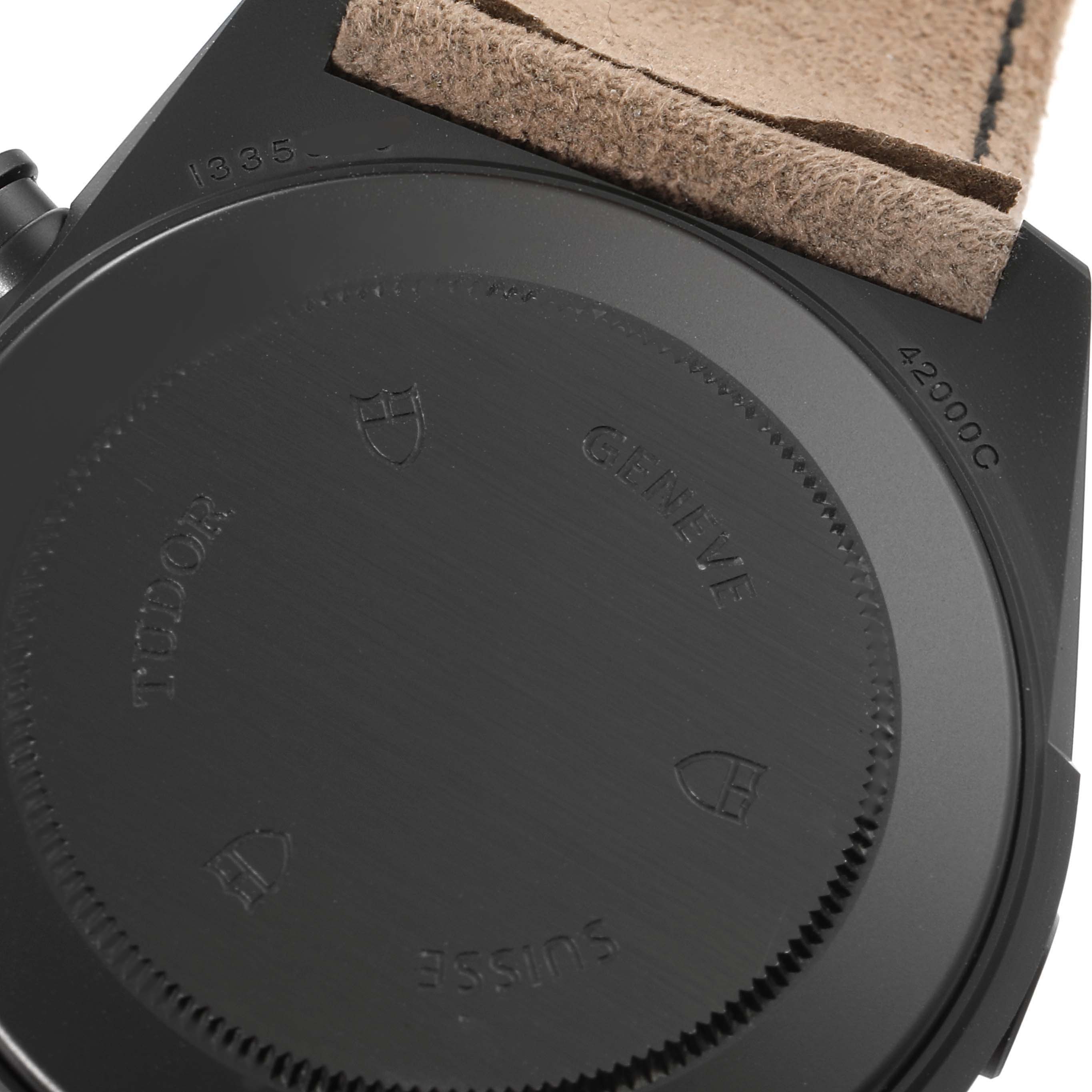 The image shows the back case of a Tudor Fastrider 42000CN Men's Ceramic Black Dial 42000CN Men's Ceramic Black Dial watch, highlighting the engraved Tudor logo and model details.