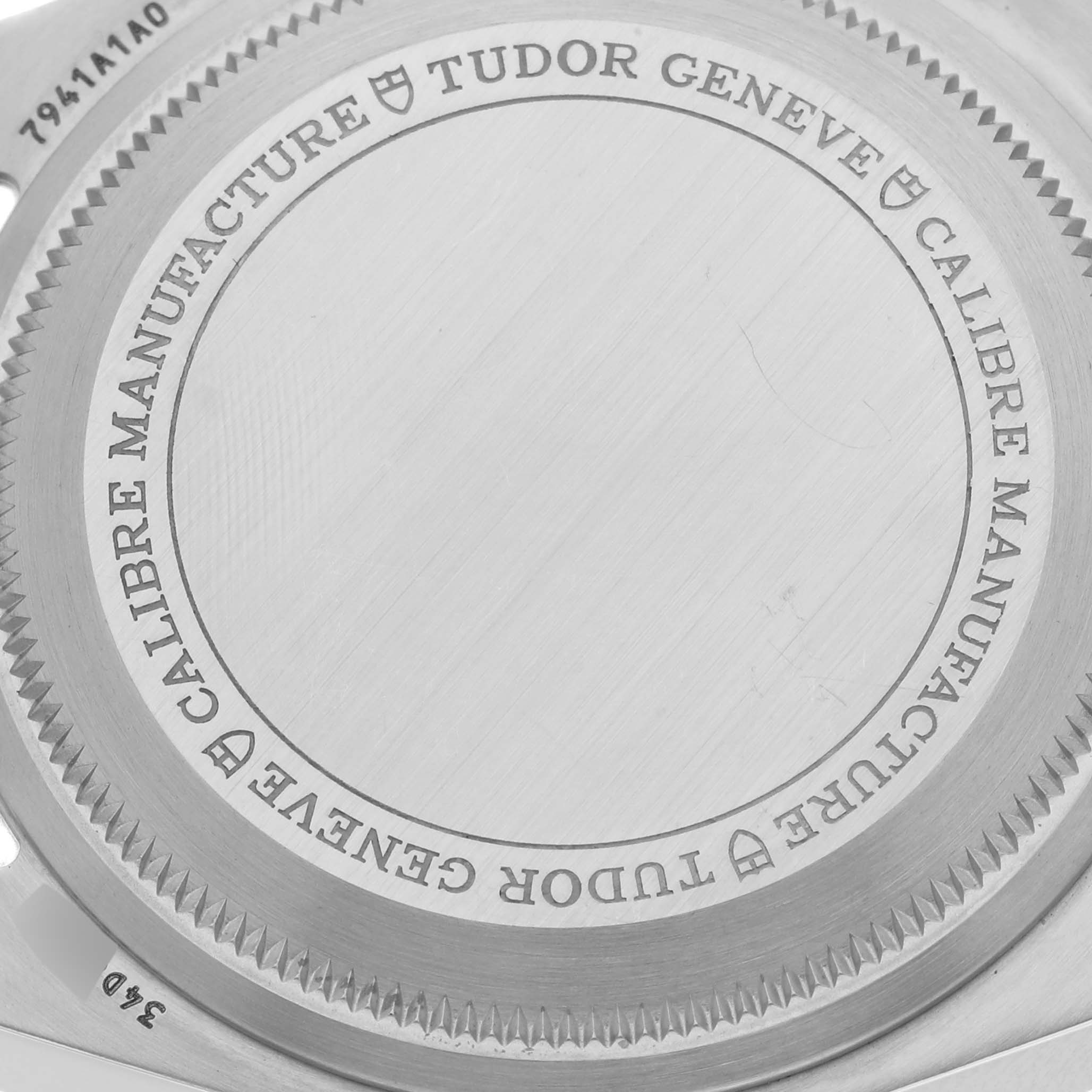 This image shows the engraved back case of a Tudor Heritage Black Bay 7941A1A0NU Men's Stainless Steel Black Dial 7941A1A0NU Men's Stainless Steel Black Dial watch, focusing on the manufacturer's details.