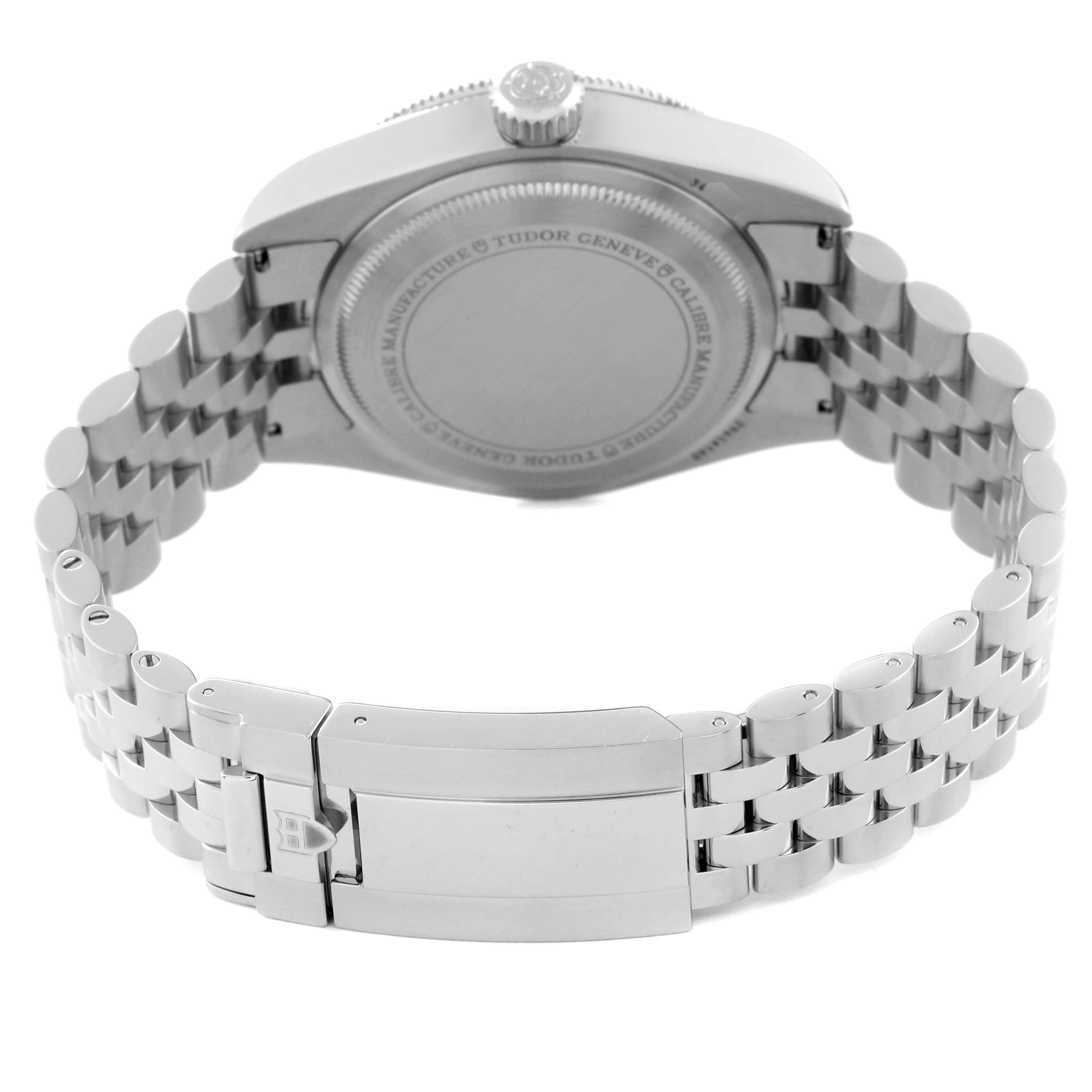 The image shows the backside and bracelet of the Tudor Heritage Black Bay 7941A1A0NU Men's Stainless Steel Black Dial 7941A1A0NU Men's Stainless Steel Black Dial watch, featuring its clasp and case back.