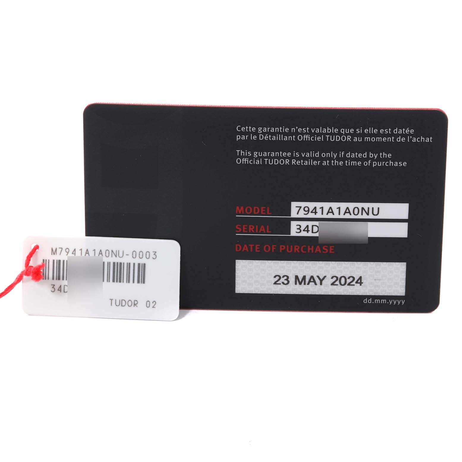 The image shows the warranty card and a tag for the Tudor Heritage Black Bay 7941A1A0NU Men's Stainless Steel Black Dial 7941A1A0NU Men's Stainless Steel Black Dial model 7941A1A0NU watch.