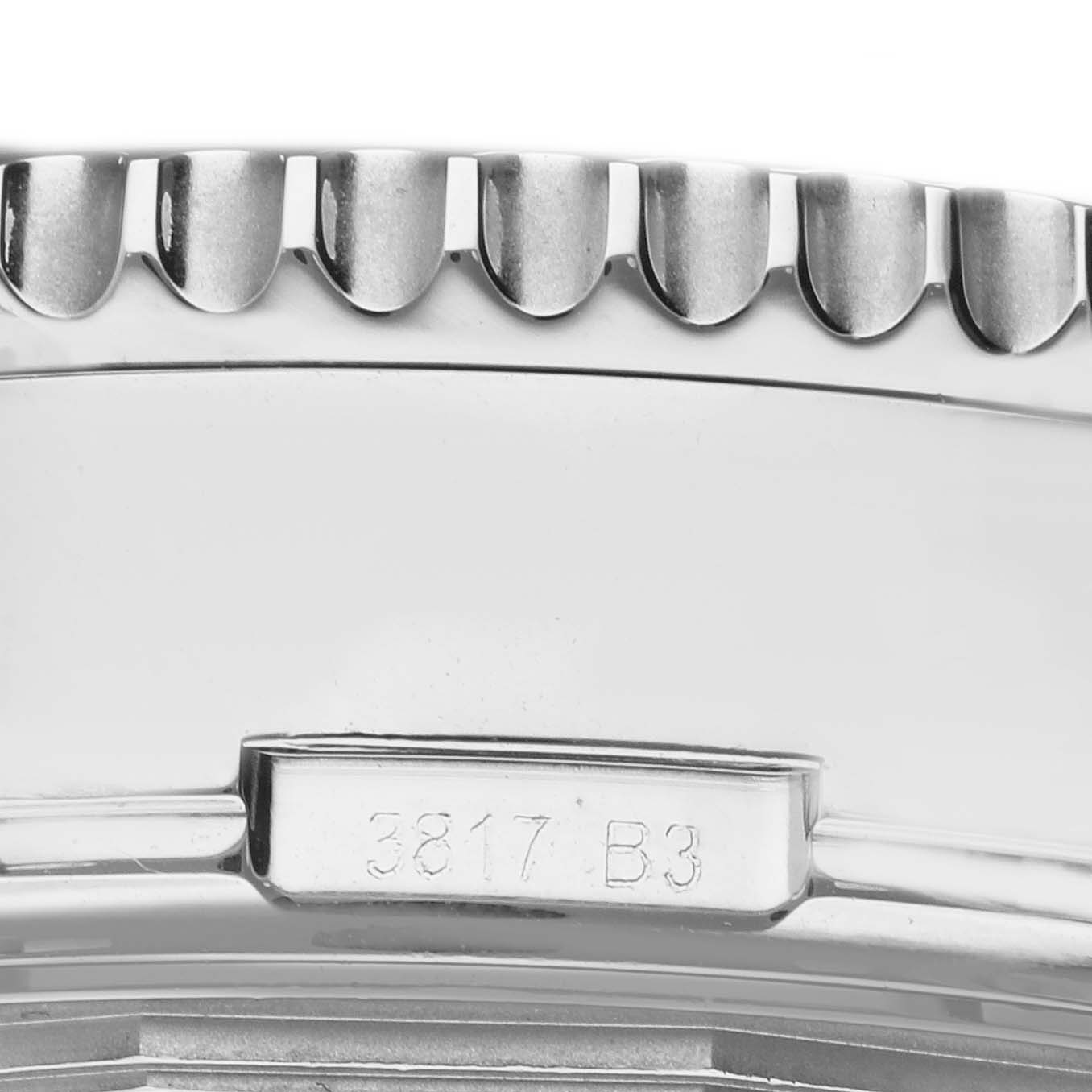 This close-up shot shows the side of the bezel and case with engraving on a Breitling Navitimer AB031021/Q615 Men's Stainless Steel Brown Dial AB031021/Q615 Men's Stainless Steel Brown Dial watch.