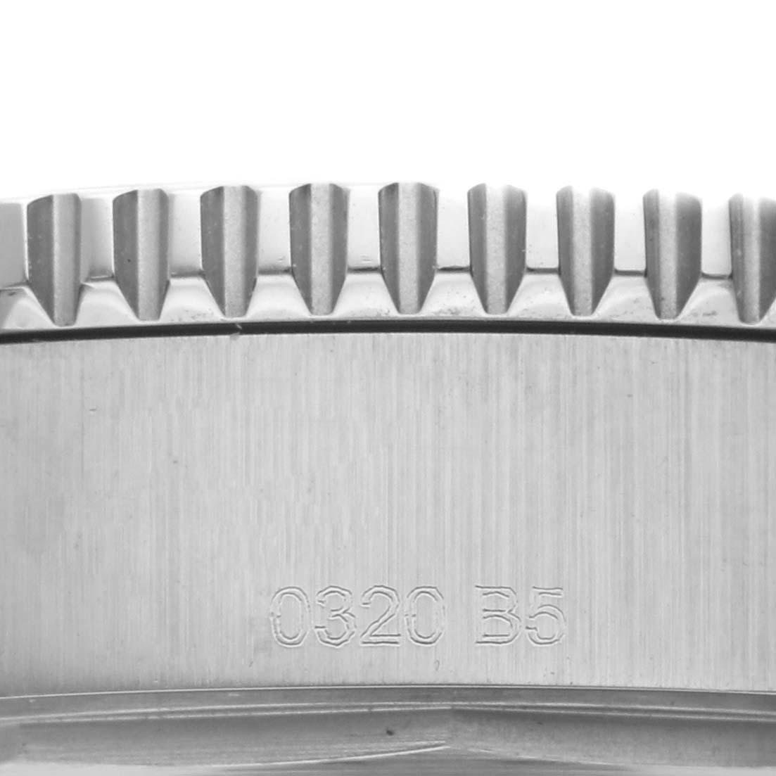 This image shows a close-up of the bezel and part of the case of the Breitling Superocean A17366 Men
s Stainless Steel Black Dial A17366 Men
s Stainless Steel Black Dial watch, highlighting its brushed finish and serial number.