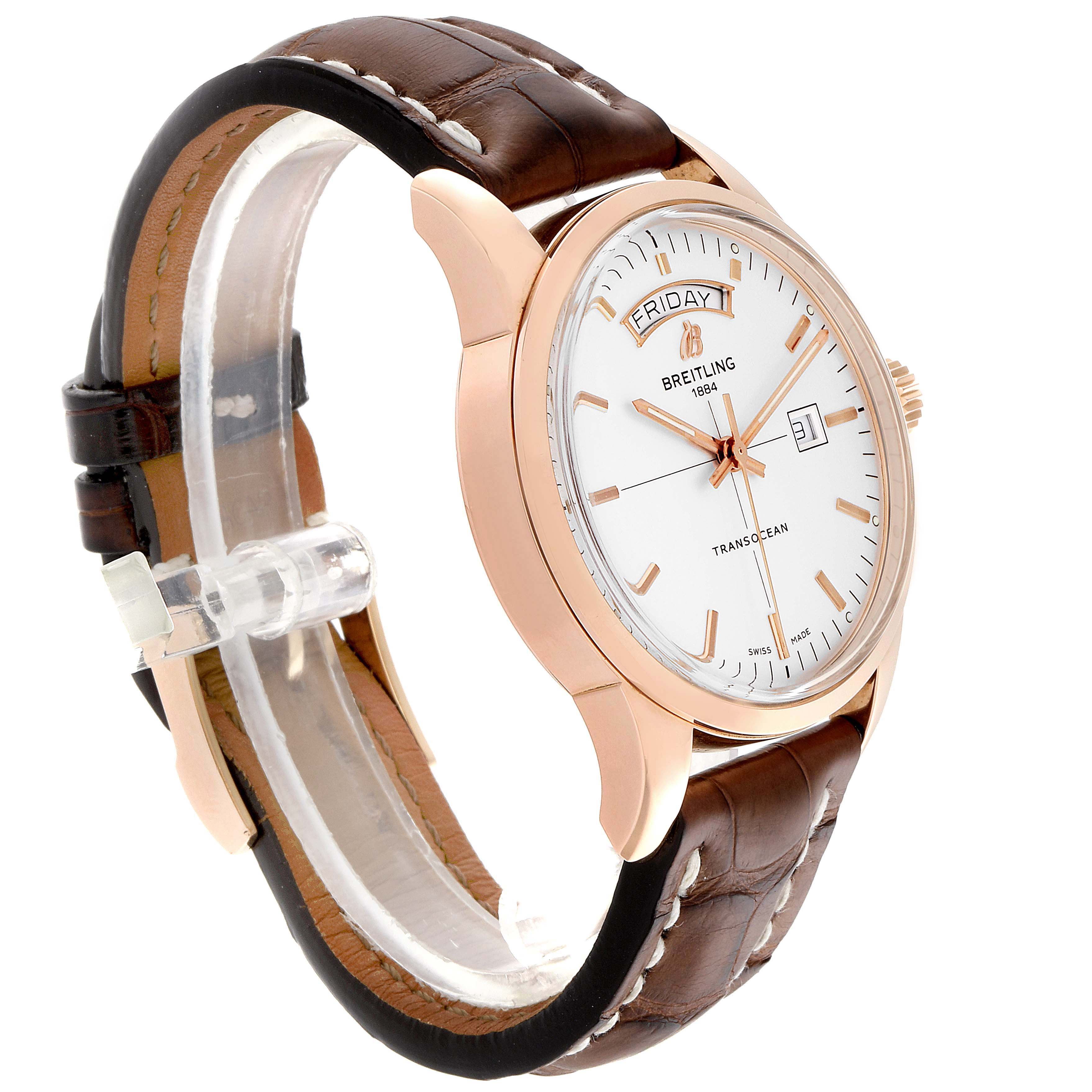 The image shows a side angle of the Breitling Transocean R45310 Men's Rose Gold Silver Dial R45310 Men's Rose Gold Silver Dial watch, highlighting its face, case, crown, and leather strap.