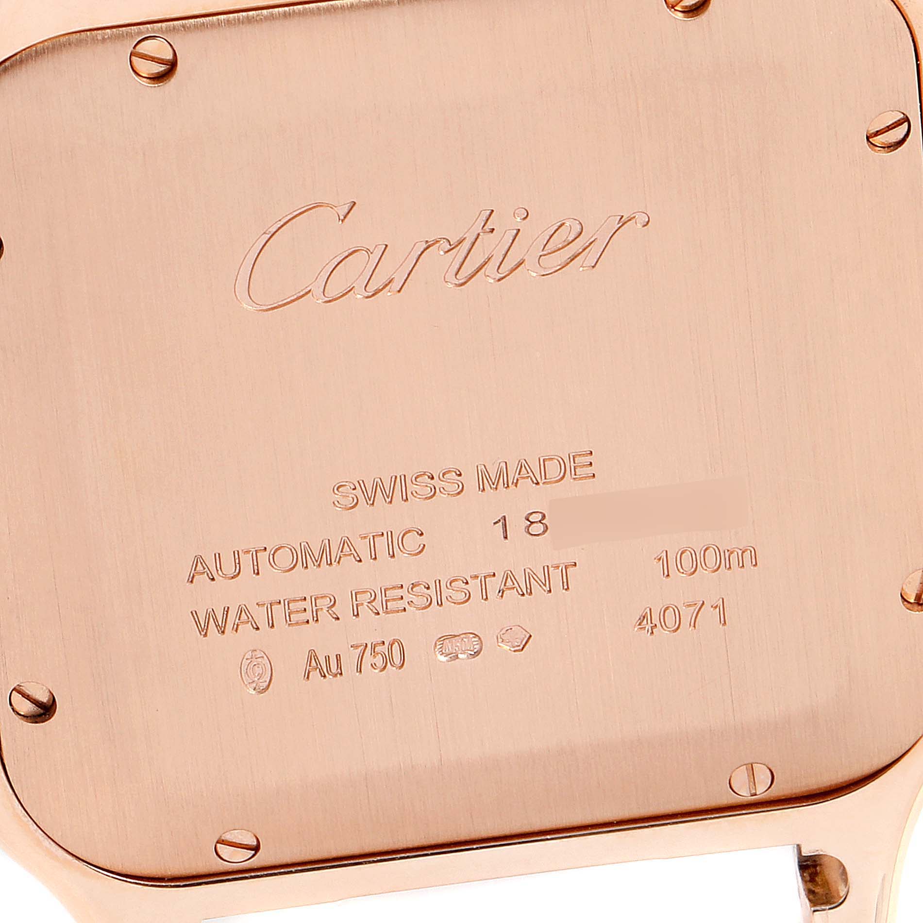 The image shows the engraved case back of a Cartier Santos WGSA0011 Men's Rose Gold Silver Dial WGSA0011 Men's Rose Gold Silver Dial watch at a close-up angle.