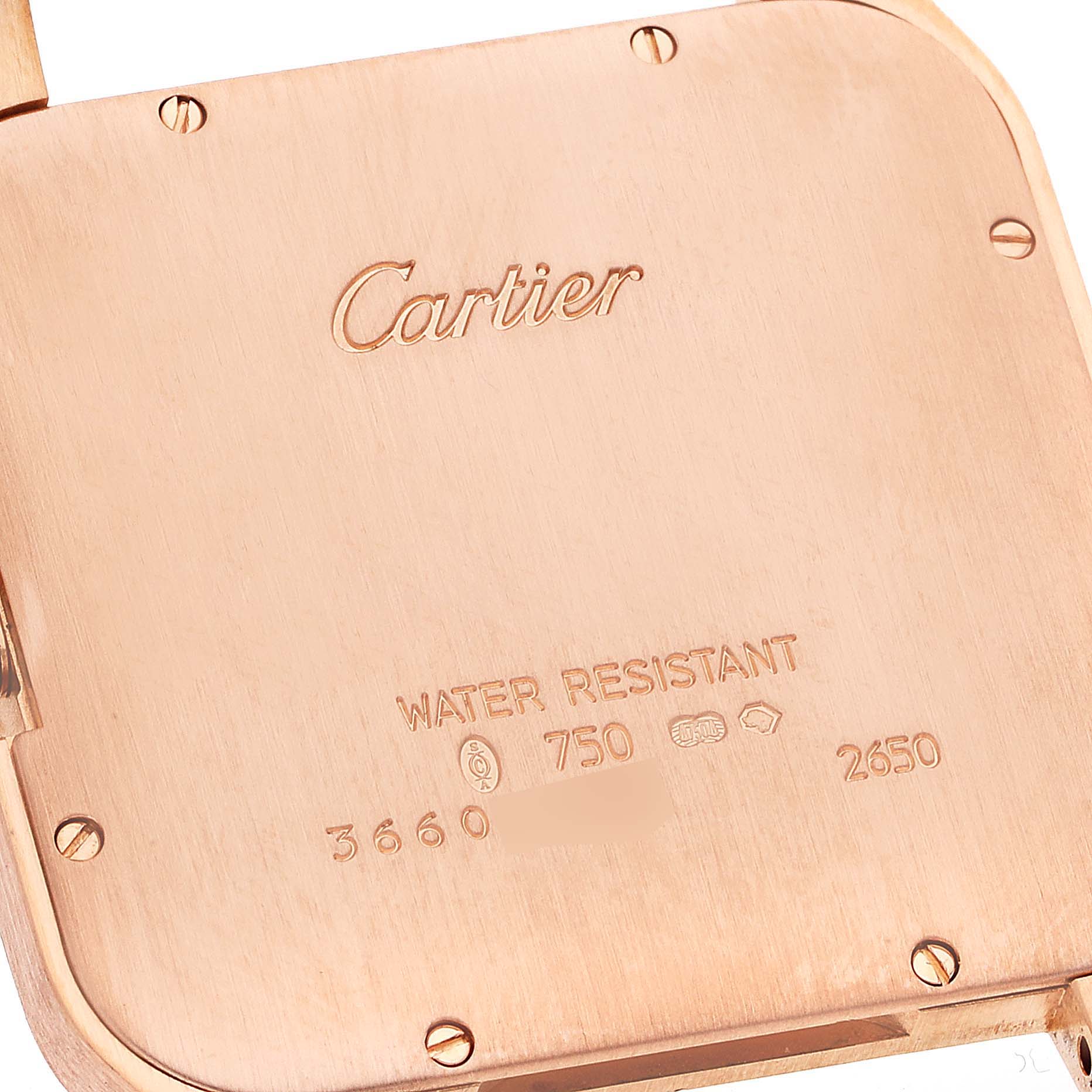 This image shows the case back of a Santos Dumont watch by Cartier viewed from the rear.