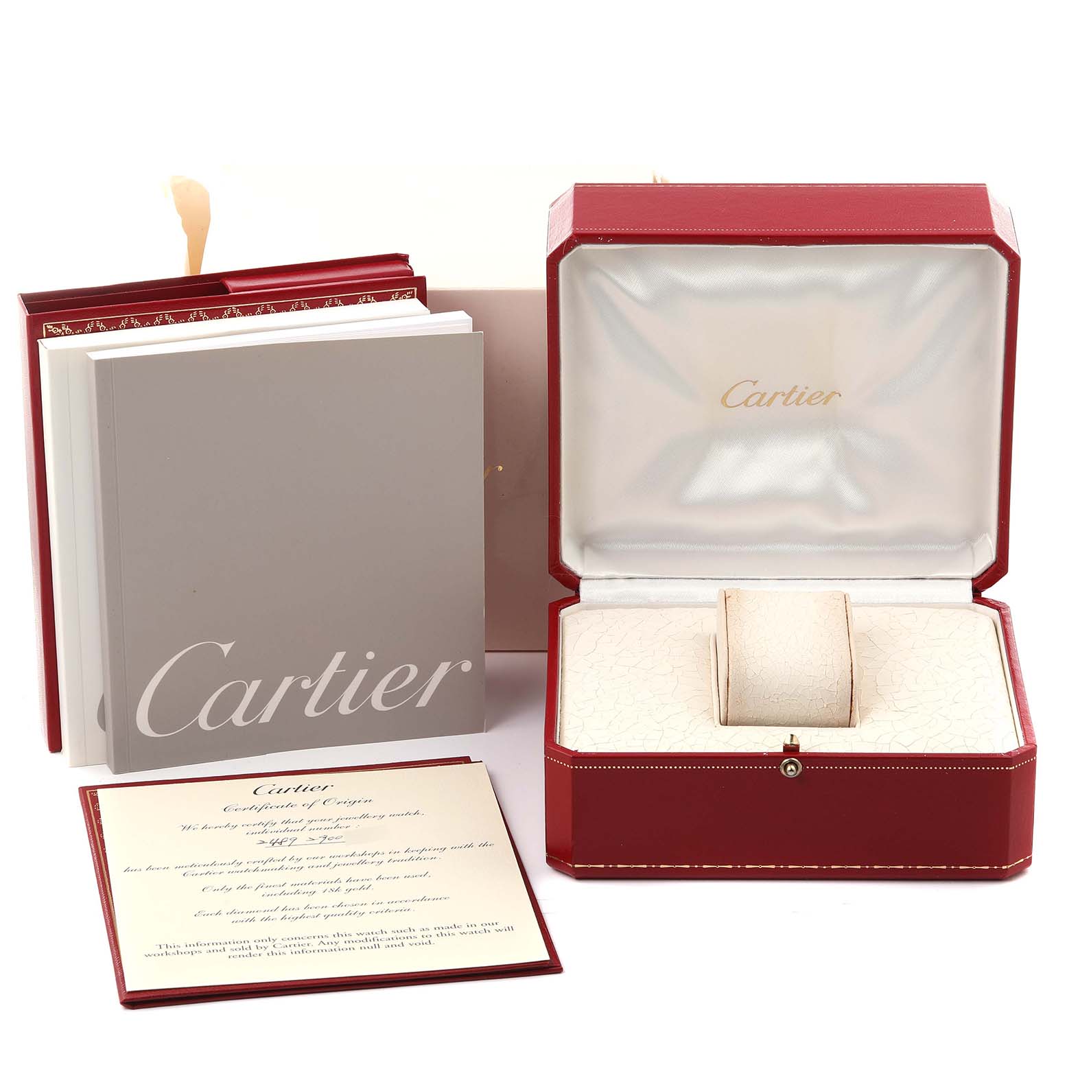 The image shows the packaging and accessories for a Cartier Tank Americaine WB7073L1 Women's White Gold Silver Dial WB7073L1 Women's White Gold Silver Dial watch, including the red box, booklet, and warranty card.