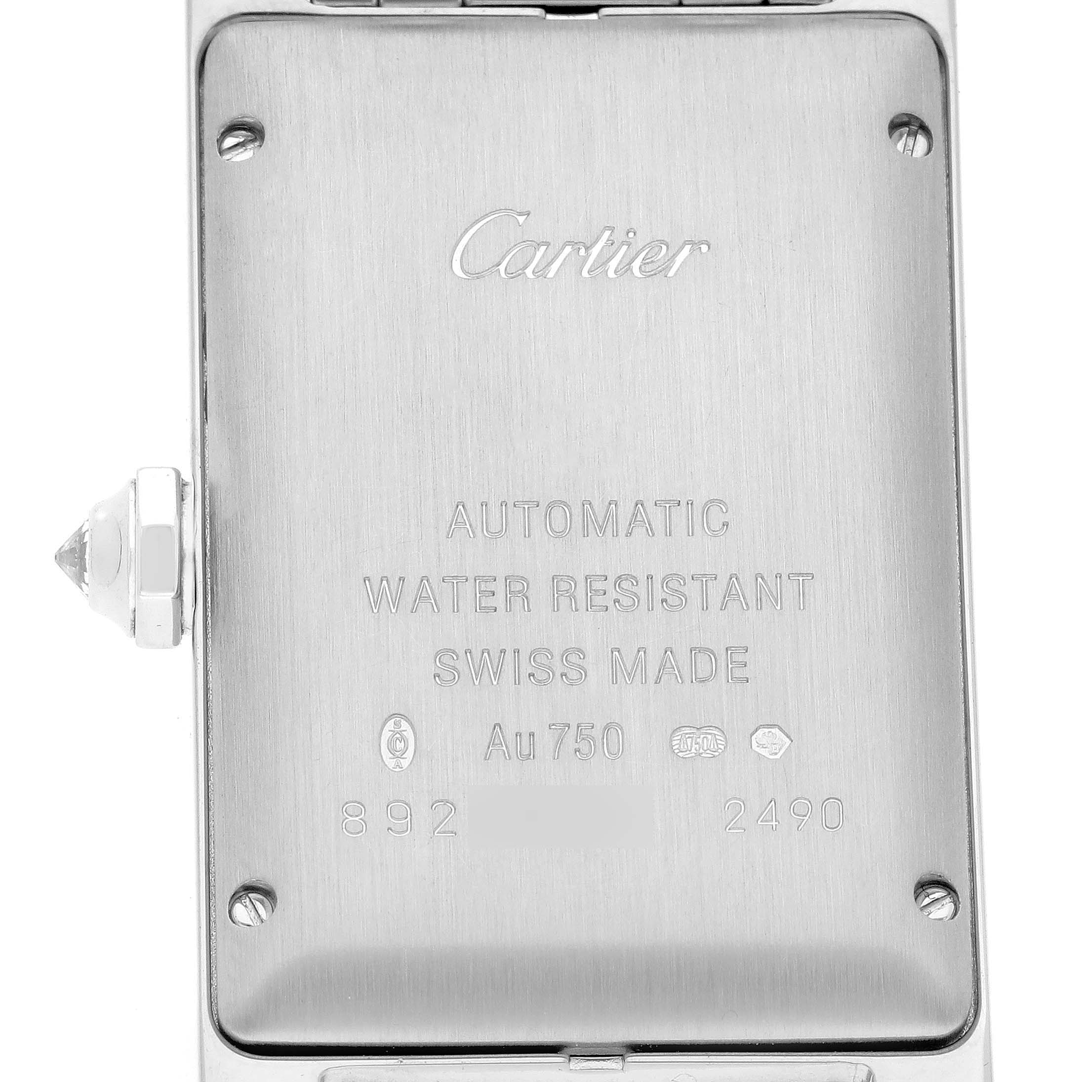 This image shows the stainless steel back case of a Cartier Tank Americaine WB7045L1 Men's White Gold Silver Dial WB7045L1 Men's White Gold Silver Dial watch, highlighting its engravings and crown.