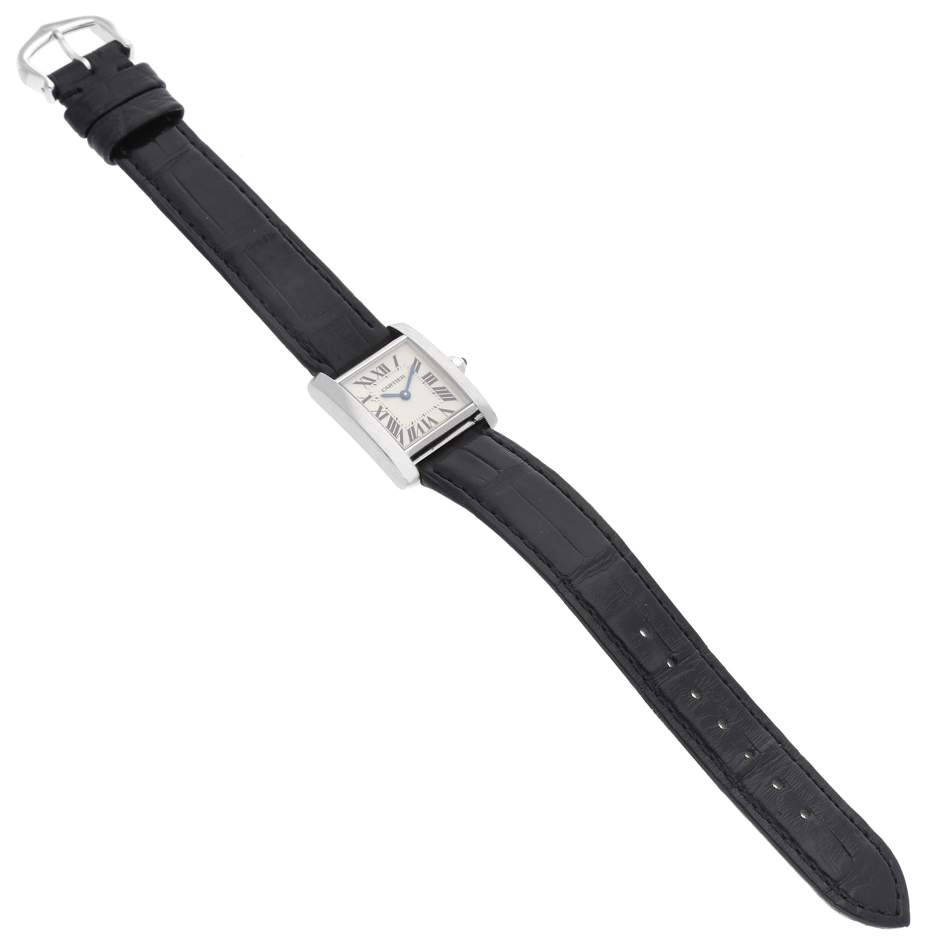 The image shows a Cartier Tank Francaise W5001256 Women's White Gold Silver Dial W5001256 Women's White Gold Silver Dial watch from an overhead angle, highlighting its face, case, and black strap.