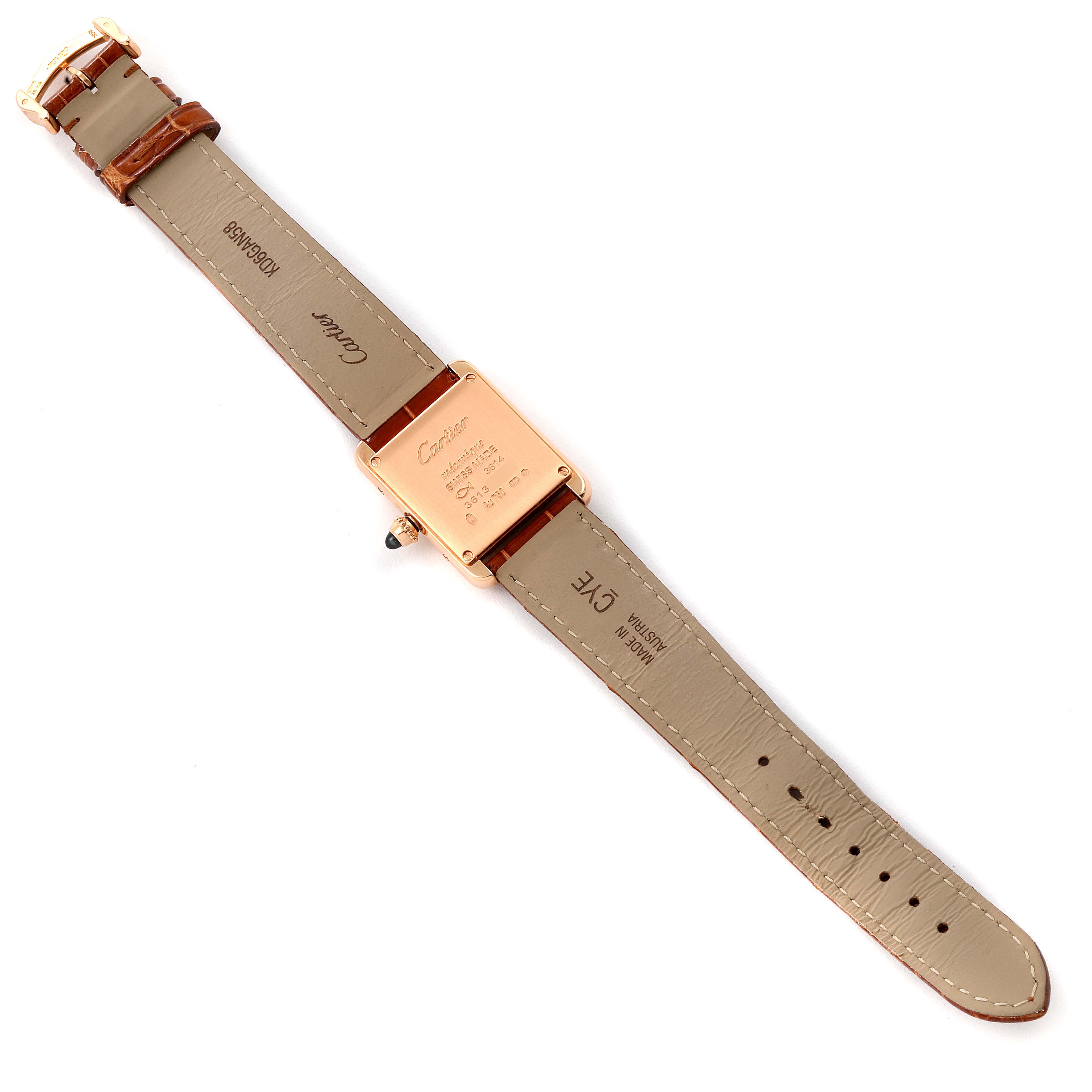 The image shows the back view of a Cartier Tank Louis WGTA0010 Women's Rose Gold Silver Dial WGTA0010 Women's Rose Gold Silver Dial watch, highlighting its beige strap and engraved case back.