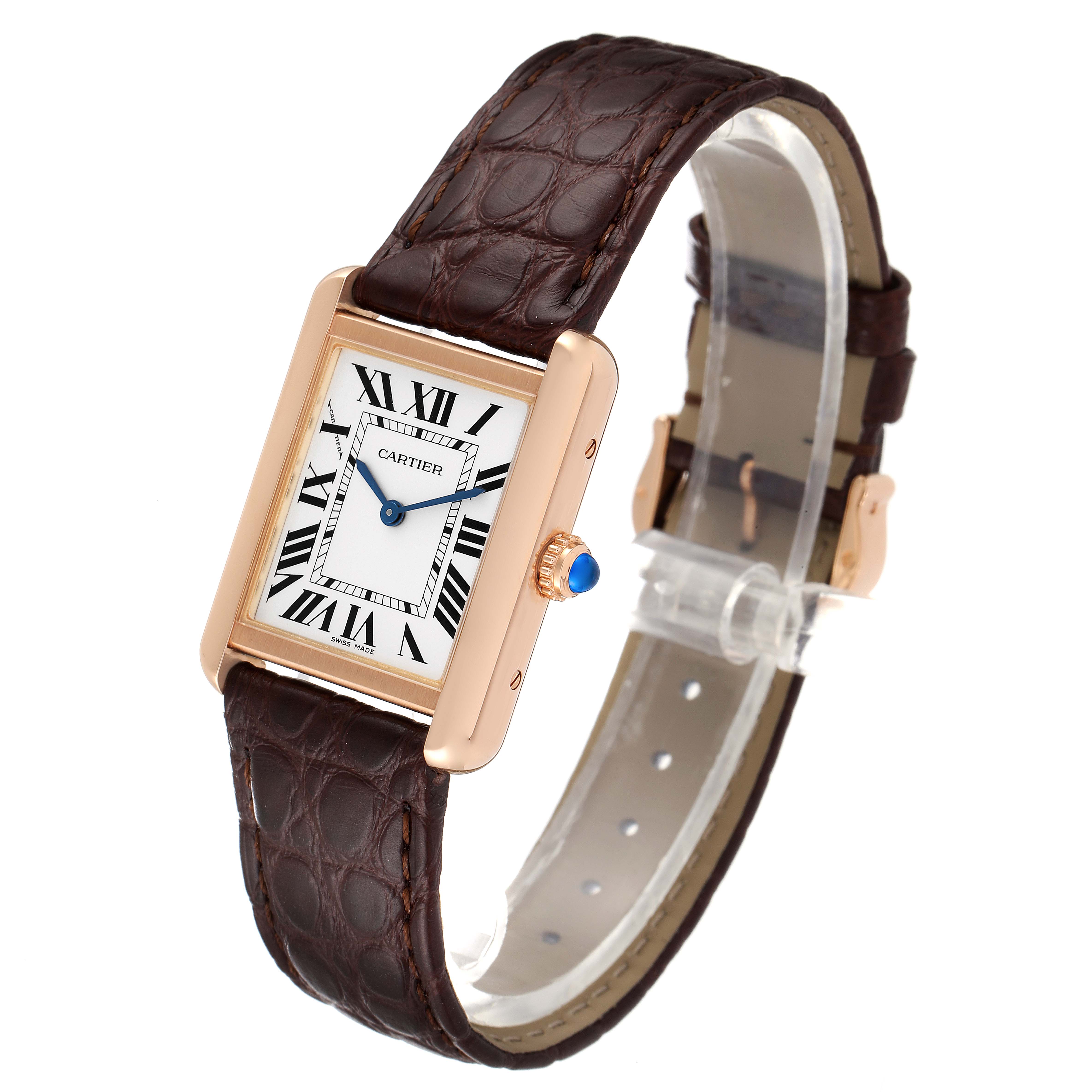 The Cartier Tank Solo W5200024 Women's Rose Gold Silver Dial W5200024 Women's Rose Gold Silver Dial watch is shown at a slight angle, displaying its rectangular face, Roman numerals, blue hands, crown, and brown leather strap.